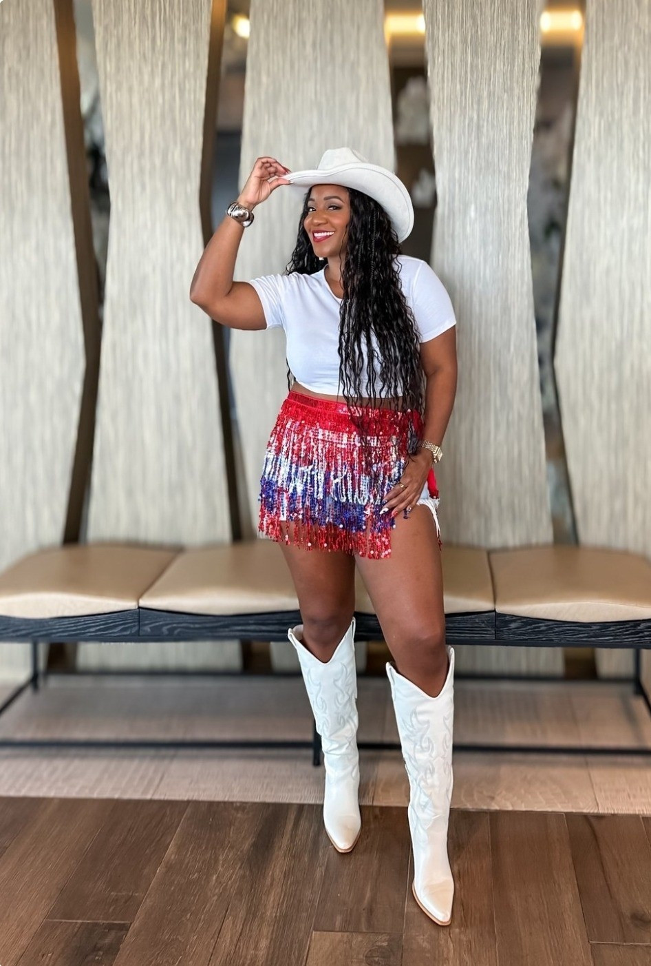 Rodeo season outfit inspo 🤠✨ A classic white tee paired with a red, white, and blue fringe mini for a fun, statement look that still feels effortless. Finished with white cowboy boots and a hat for the full rodeo-ready viberodeo outfit inspo / rodeo season outfit / western outfit for women / cowboy boots outfit / fringe skirt outfit / red white blue outfit / concert outfit western / rodeo fashion women / cowgirl outfit inspo / country concert outfit / western chic style / summer rodeo look

#LTKootd #LTKMidsize #LTKSeasonal