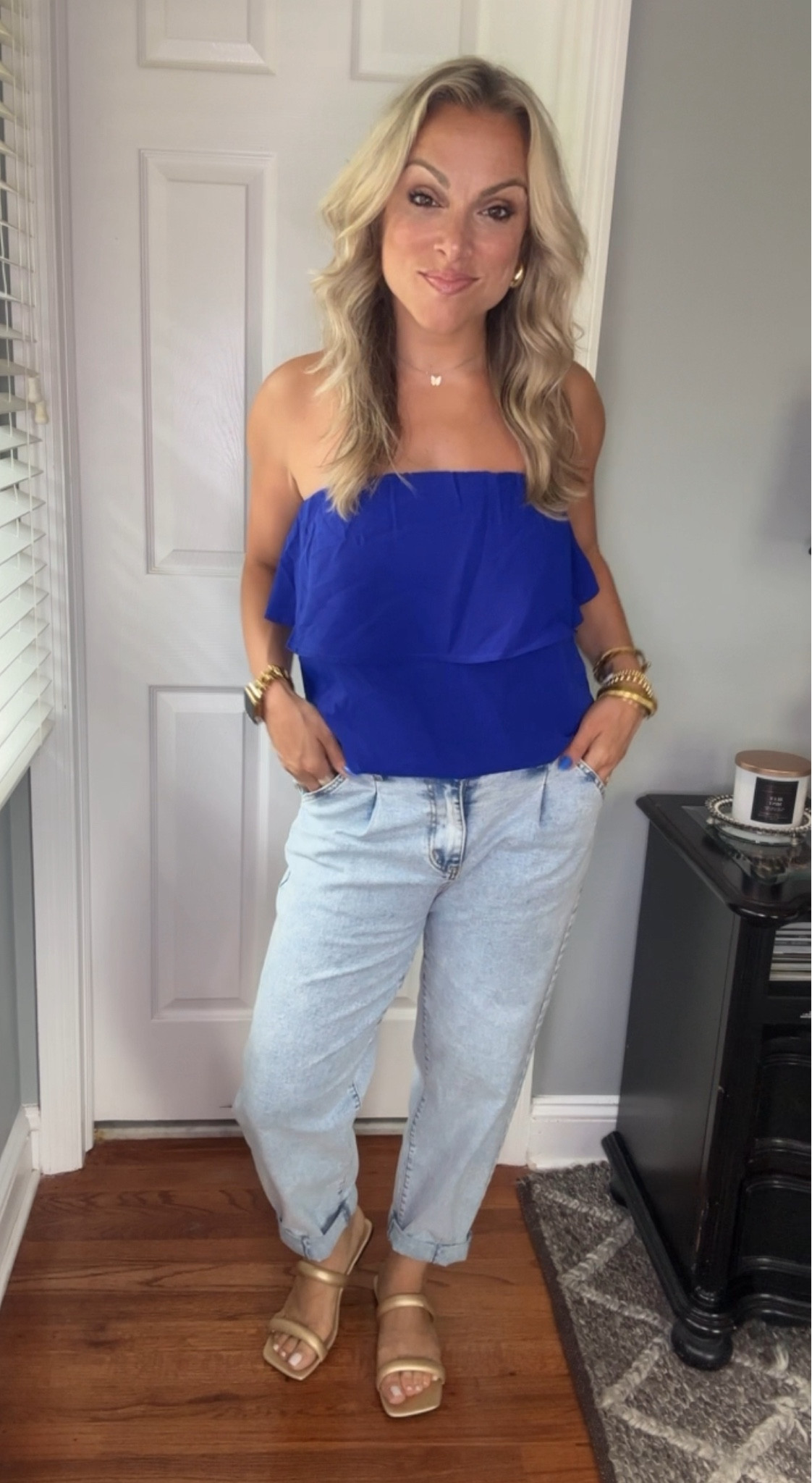 Easy Summer fit with pop of color. Cobalt blue tube top ruffle tiered top. Flowy and comfortable. Wearing a size small. Size 4 in barrel jeans. Paired with gold sandals and accessories.