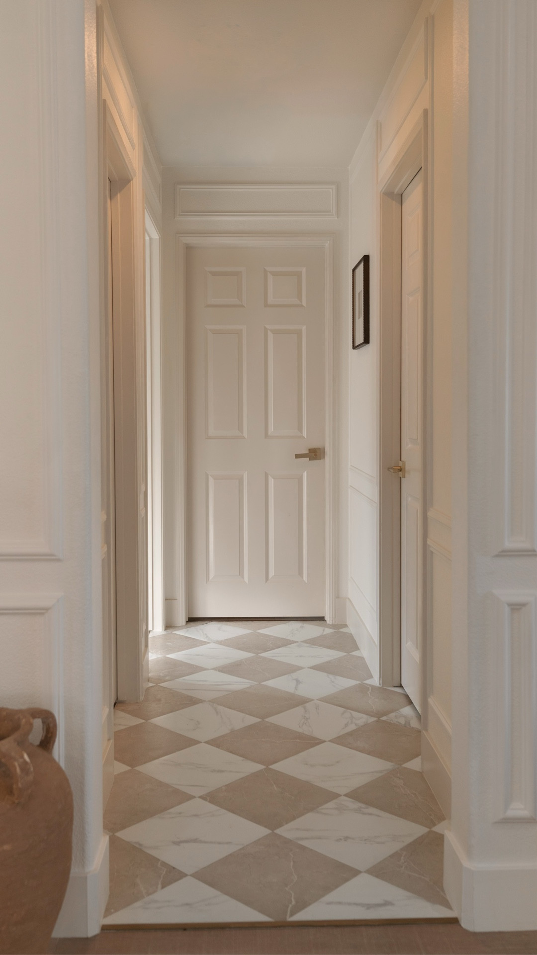 Proof you shouldn’t ignore small spaces.

I’ve been dying to do a checkered tile somewhere in our home, and the hallway felt like the perfect spot.

I tried a few peel-and-stick sets, but every white leaned a little too blue — so I mixed two different ones, and this combo ended up being perfect.

Installed over paper so it’s totally renter-friendly (and ideal if you change your mind often… guilty).

Sealed the edges, added grout for that real tile look, finished with a brass transition, and painted the trim and doors in soft, contrasting tones.🤍

Sharing everything I used here!