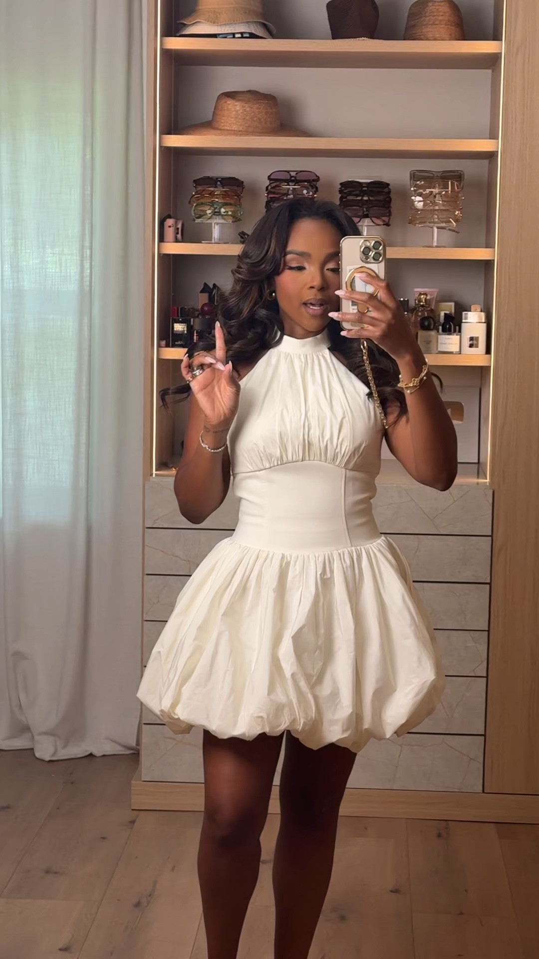 Hi Babes! 🤍✨

This dress is giving bridal, birthday, and luxury all in one.

The bubble hem is such a statement, the cinched waist creates the prettiest silhouette, and the halter neckline makes it feel so elegant. It's one of those dresses that looks designer without the designer price tag.

Fit Details:
• White bubble hem mini dress
• Halter neckline
• Structured cinched waist
• Voluminous bubble skirt
• Neutral heels
• Gold jewelry

Where to wear:
• Bridal shower
• Bachelorette party
• Birthday dinner
• Graduation
• Vacation nights
• Summer celebrations

Everything is linked below!

xx, Kira | IG: KirasFashionFinds

Measurements: 5'3" | Wearing Size XS