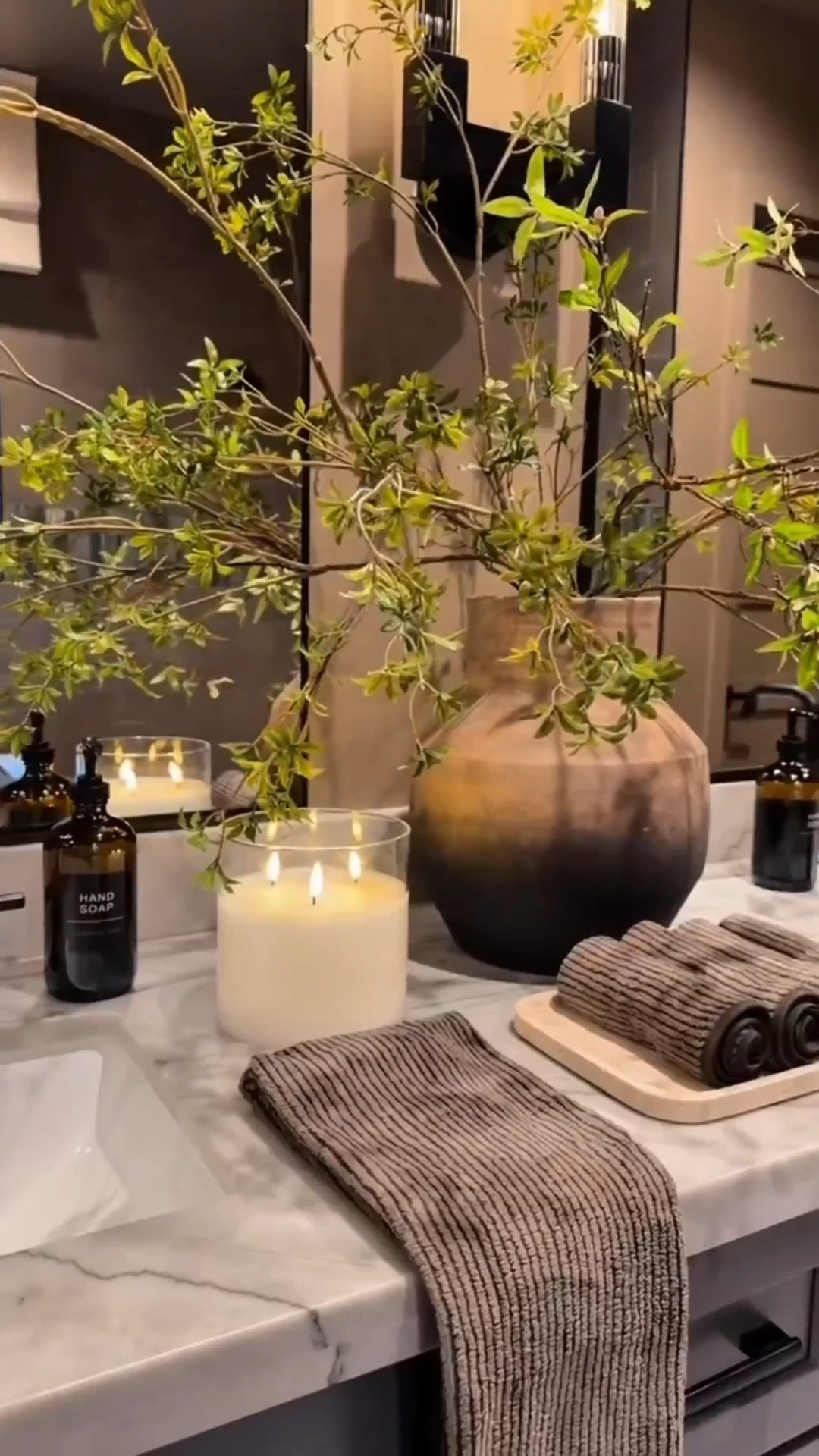 Changes we made:

Three affordable mirrors instead of one for more scale and impact. 💥 A warm, rich neutral brown paint to soften the grey. 💥Wall sconces to elevate the space without a full remodel. 💡 

A few functional and affordable decor finds to pull it all together

Bathroom makeover 
Moody bathroom 
Affordable bathroom finds 



#LTKHome #LTKvlog #LTKdayinmylife