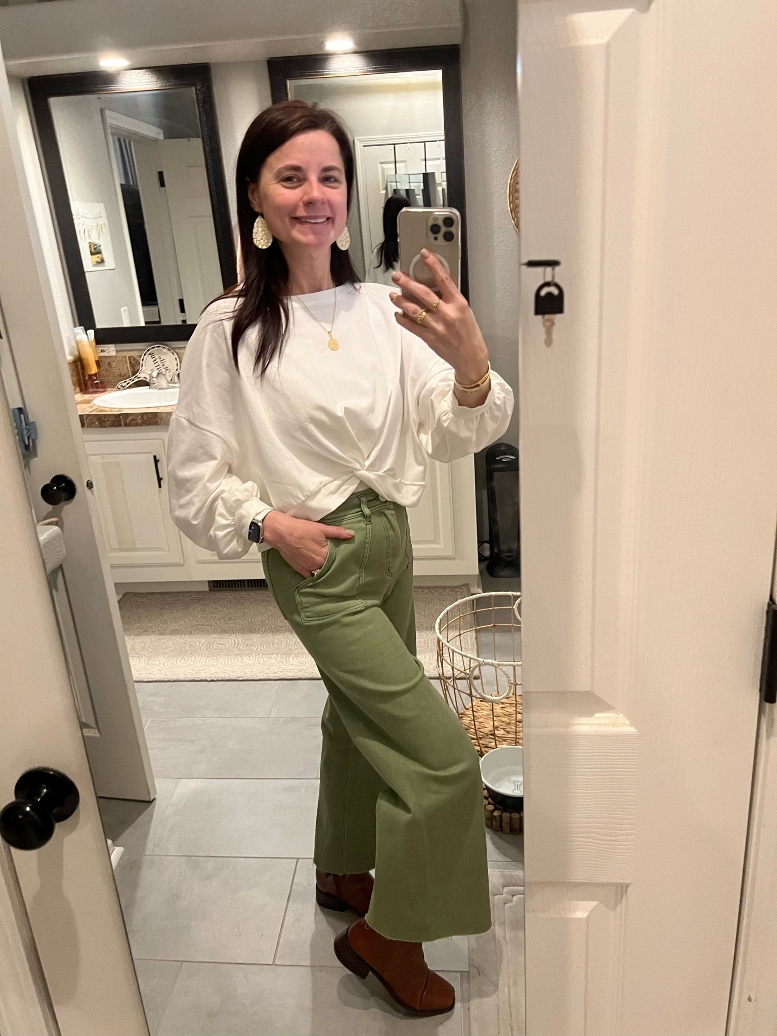 I love this wide pant look with a twist front top.  I found a similar top but I would size up for the same look.

Sam Edelman boots complete the look!

#LTKstyletip #LTKover40 #LTKshoecrush