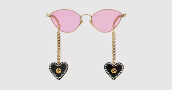 Cat eye sunglasses with heart shaped charms | Gucci (US)