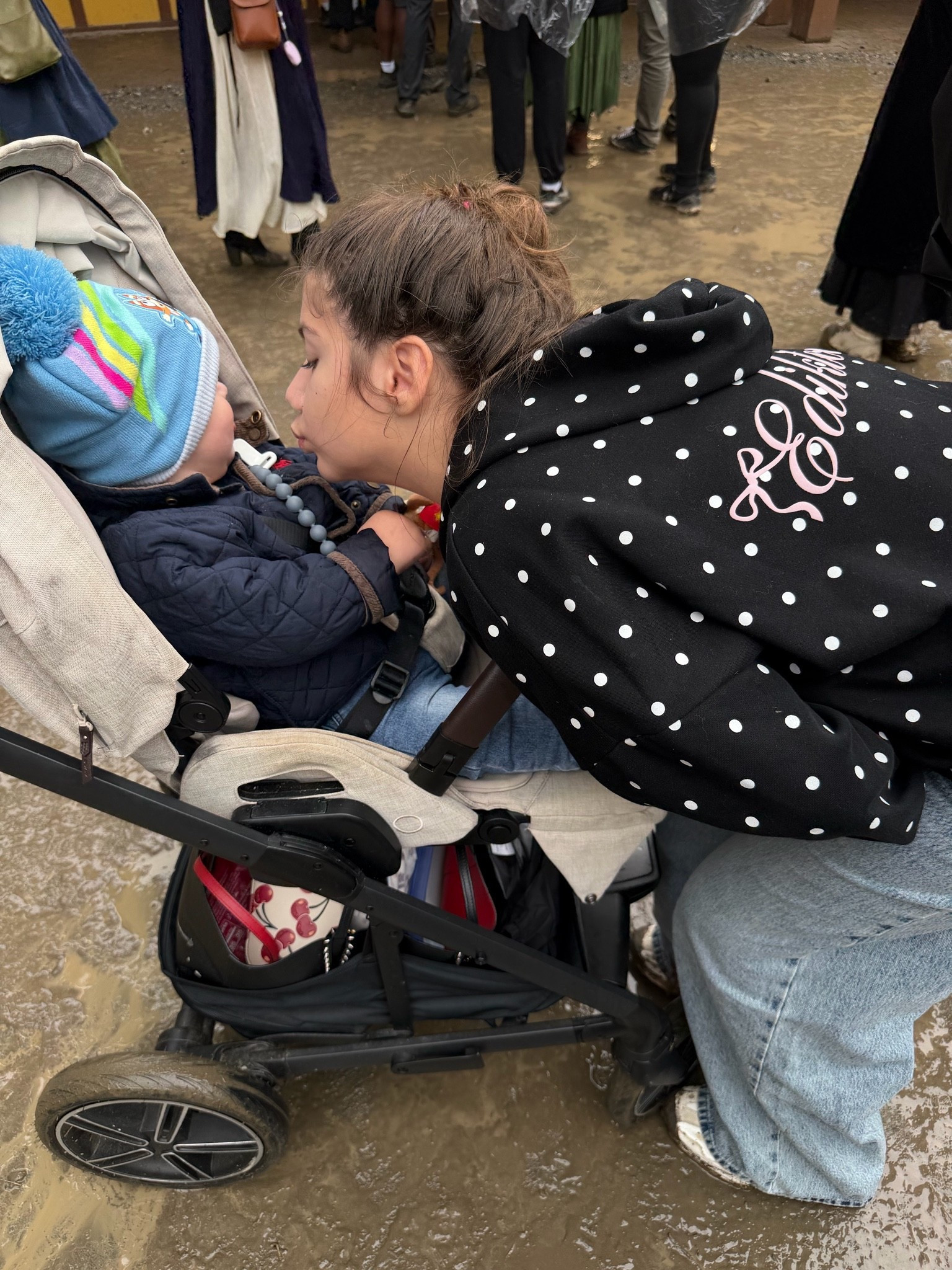 The moment a small figure settles into a seat shows how simple comfort can make a difference. Her stylish polka dot sweatshirt, complete with the cute girly touch of bow embroidery, adds a charming warmth to the scene. A quiet pause in the crowd often holds the most joy. #LTKmomlife

#LTKmomlife