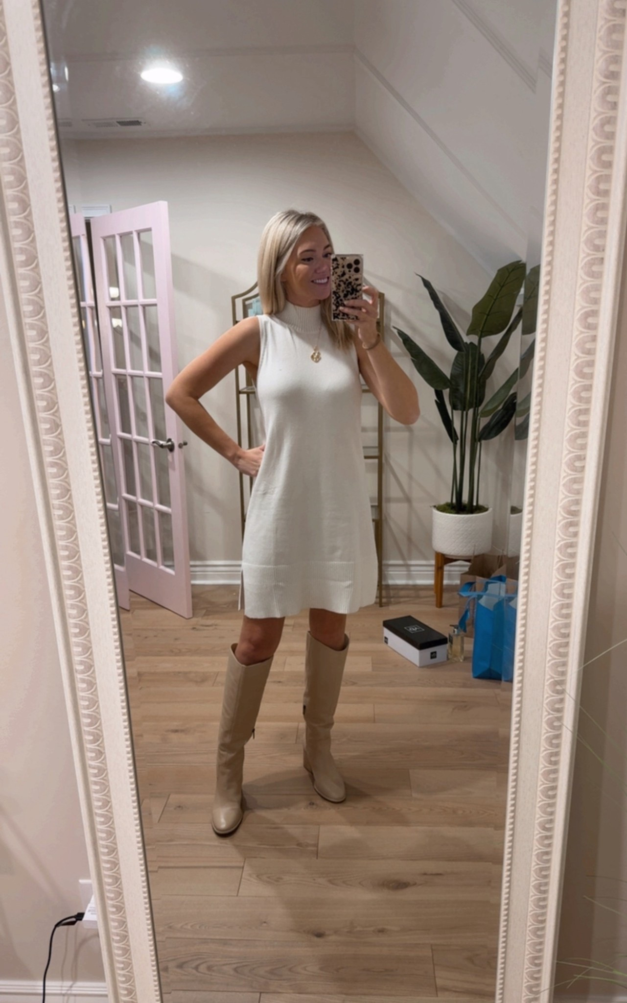 Sleeveless sweater dress 
Amazon sweater dress
Beige boots 