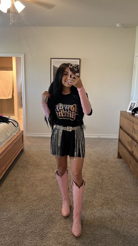 BARBIE INSPIRED WESTERN OUTFIT 🤠 | PART III
Are you sick of me yet?! 🤪 Found this cute ass tee (*sized up to a large)on @shopwhiskeydarling site and paired it with their sheer layering top! Linking a similar belt and pink Barbie boots in bio! @ariatinternational 

#barbie #hibarbie #hiken #barbiethemovie #barbiestyle #barbieoutfit #barbiedoll #barbiegirl #westernbarbie #cowgirlbarbie #concertoutfit #cowgirlboots #westernfashion #cowgirlchic country concert outfit | country concert ootd | morgan wallen concert outfit | cowgirl boots outfit | cowgirl style | cowgirl chic | western fashion inspo | western outfit | western style

#LTKSeasonal #LTKstyletip #LTKunder50