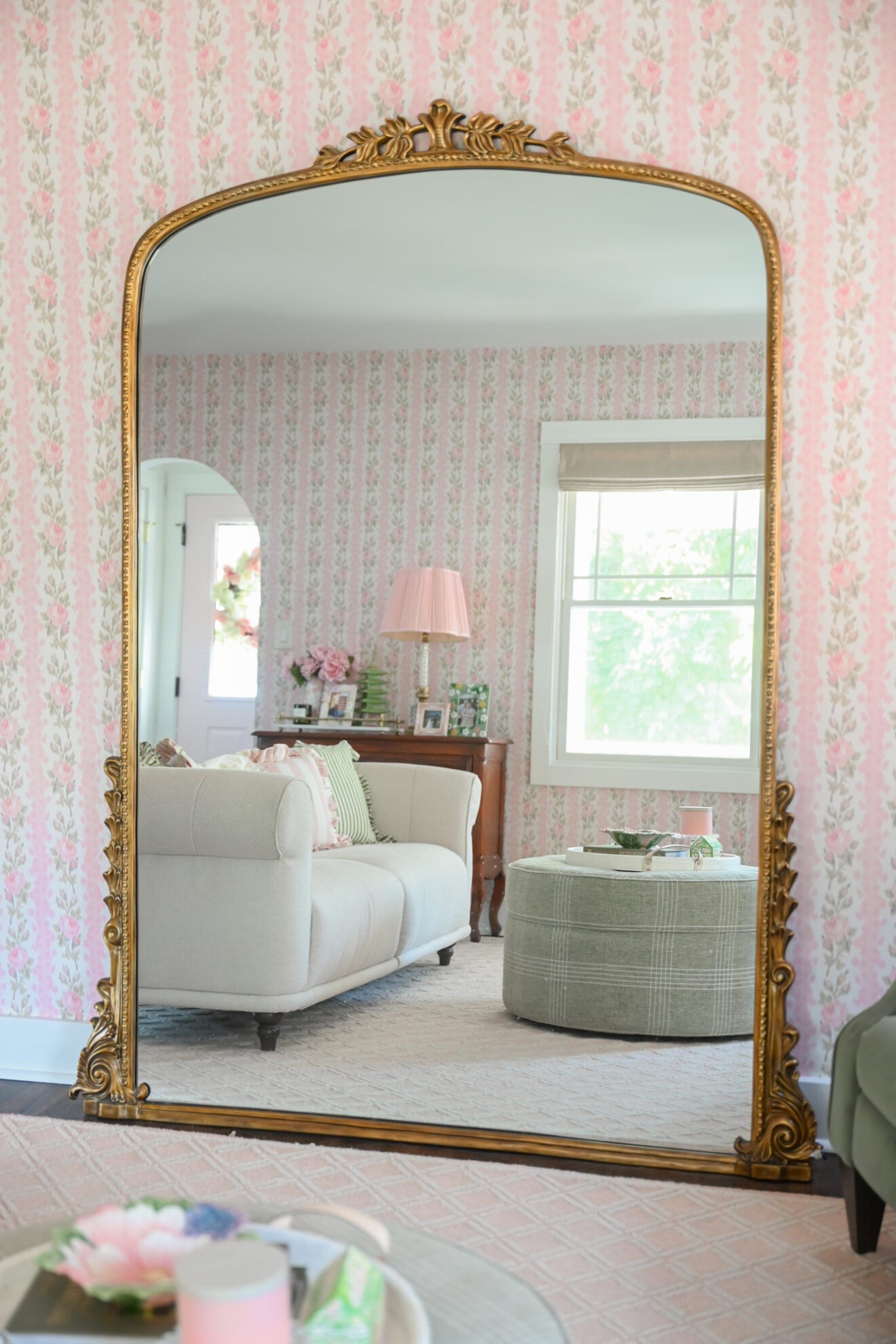 Anthropologie Gleaming Primrose Mirror

After wanting one for two years, I finally ordered myself the iconic Gleaming Primrose Mirror from Anthropologie. This viral product is a customer and influencer favorite, and even though Anthropologie has released a number of similar oversize mirrors since, I still love this one with the arched top and decoratively carved frame. In addition to as a piece of furniture and decor, I plan to use this mirror for outfit try-ons and as an outfit backdrop for blog and Instagram content. When it’s strictly being used as decoration, I might hang a wreath over the top using a thick pink velvet ribbon.

Unfortunately, my mirror was slightly damaged during delivery. You can see a chunk of the plaster is missing on the bottom right corner. Anthropologie offered to exchange or return it for free, but also offered a steep discount if I wanted to keep it. All my DIY and painting projects this summer must have me feeling confident. Because I’m going the discount route, getting refunded a few hundred dollars, and touching up the paint myself.

A year later, and I still haven’t touched up the paint, so I guess the ding doesn’t bother me too much! This mirror was such a splurge, but I’d 100% buy it again. It’s such a beautiful piece, it reflects so much light in the room, and I shoot a ton of fashion content for my Instagram in front of this mirror. Plus, I didn’t want to hang a lot of art in this room and have it detract from the wallpaper. But a giant wall mirror complements the wallpaper while offering some contrast and interest.

#LTKHome