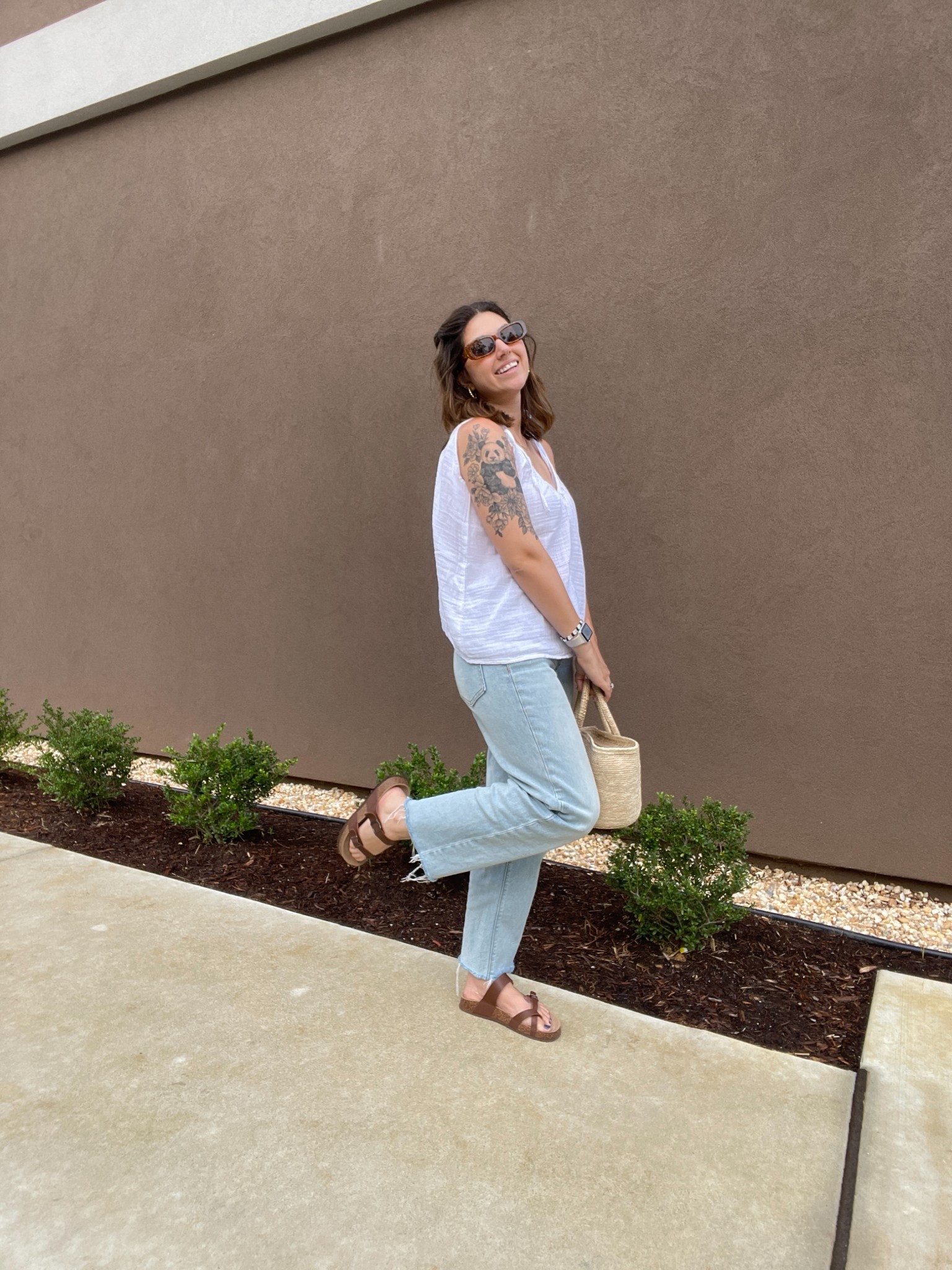 Casual women's summer outfit. I am wearing a white flowy tank top originally from Old Navy, I have linked some similar ones, light washed jeans from Old Navy, a straw purse, brown sunglasses from Amazon, and brown sandals. #womensfashion #sunglasses #amazon #ltkamazon #summer #ltksummer #summerfashion #casualoutfit  

 #LTKSummerEdit #LTKSeasonal #LTKFindsUnder50