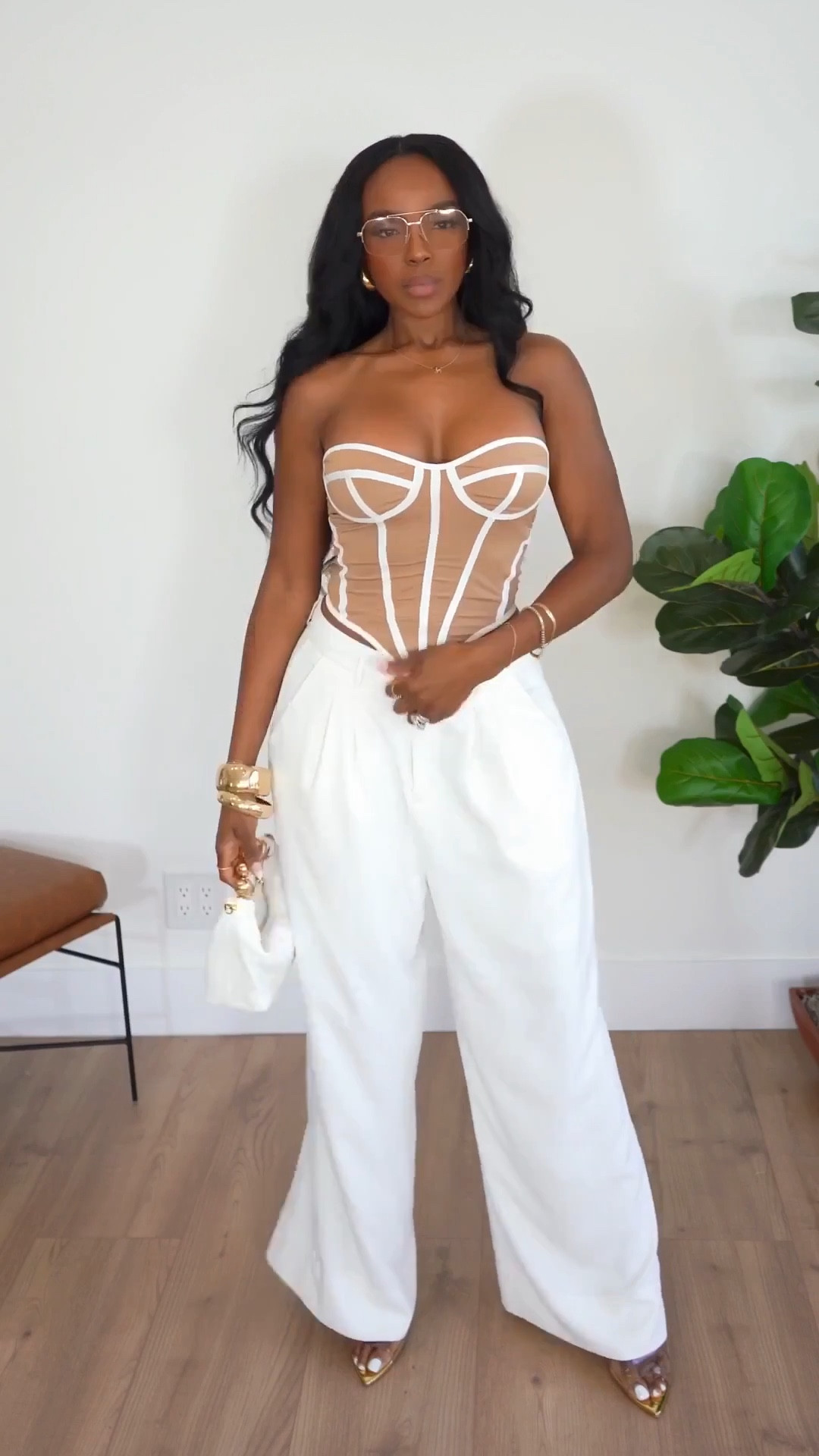 Scroll to shop this effortless neutral outfit that feels both elevated and relaxed. The wide-leg white trousers paired with the structured neutral top create a polished look that’s easy to style for multiple occasions, making it a great long-term piece with strong cost-per-wear value.

Perfect for vacation outfits, brunch dates, summer dinners, resort wear, and elevated everyday looks.

5'4" | 138 lbs | 34D bust | 27" waist | 40" hip