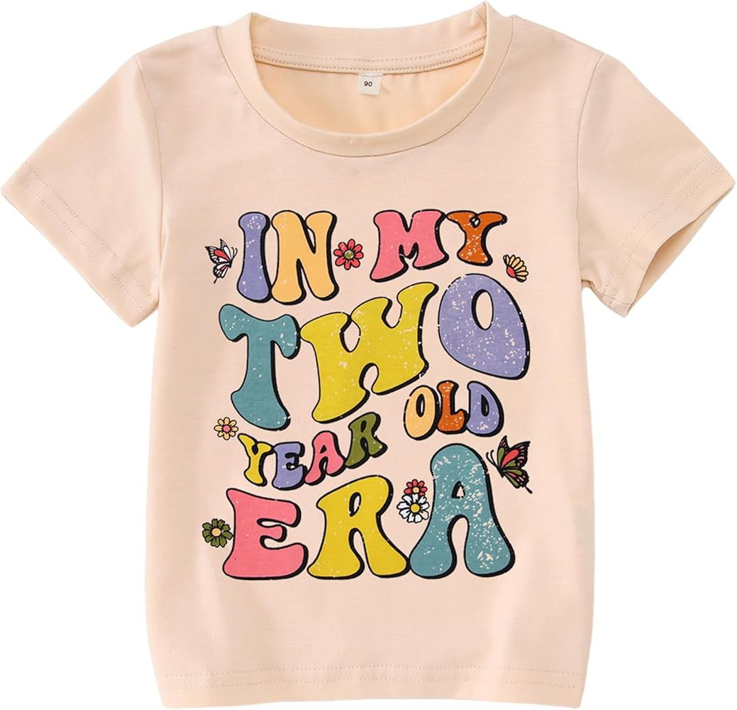 BOUTIKOME Camiseta de manga corta con texto en inglés "In My One-Seven Years Old Era" para niña... | Amazon (US)