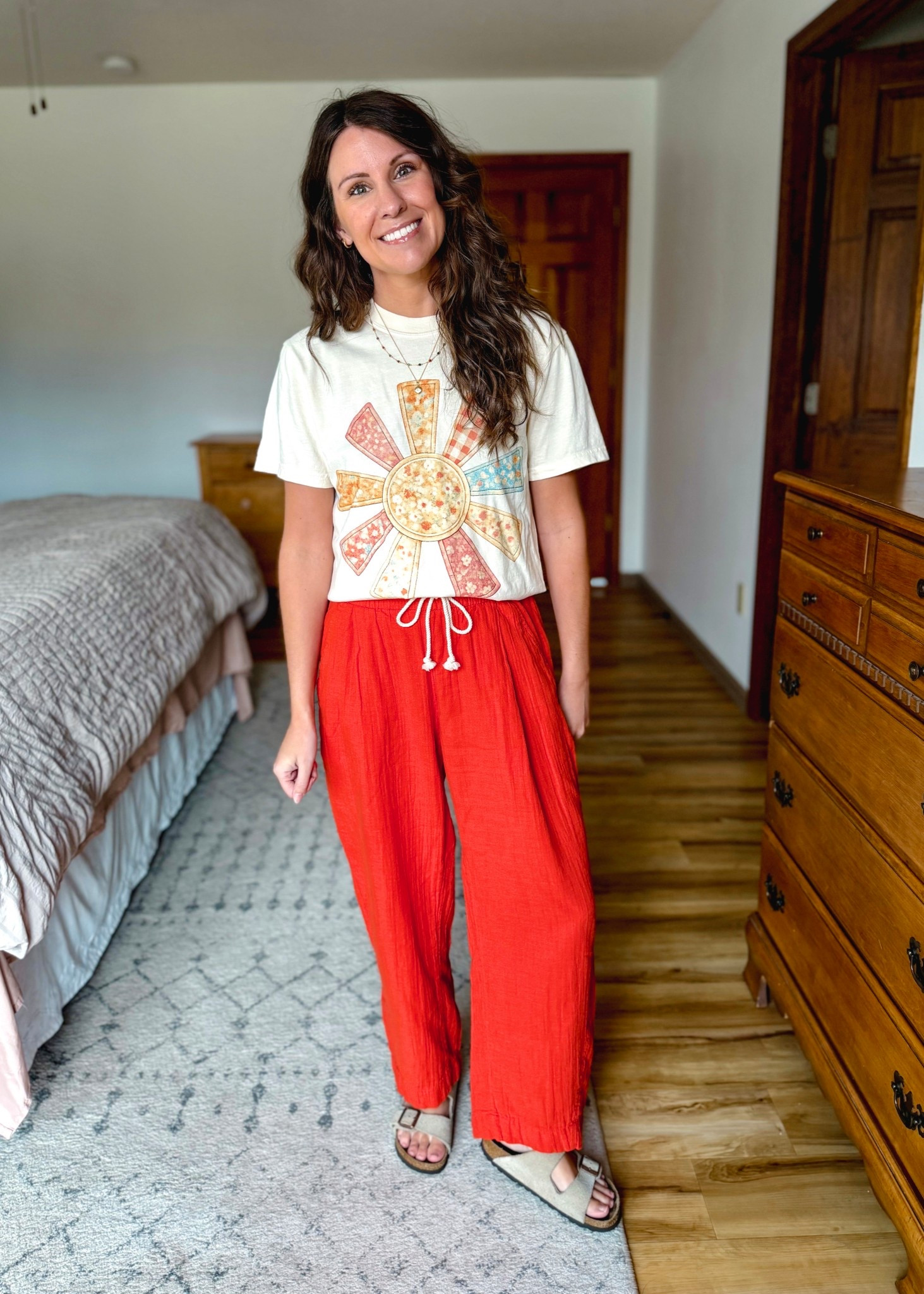love this adorable sunshine tee! So cute and colorful. It pairs nicely with these red gauze cotton pants♥️

Tee: Small 
Red pants: xs petite 
Sandals: 6 