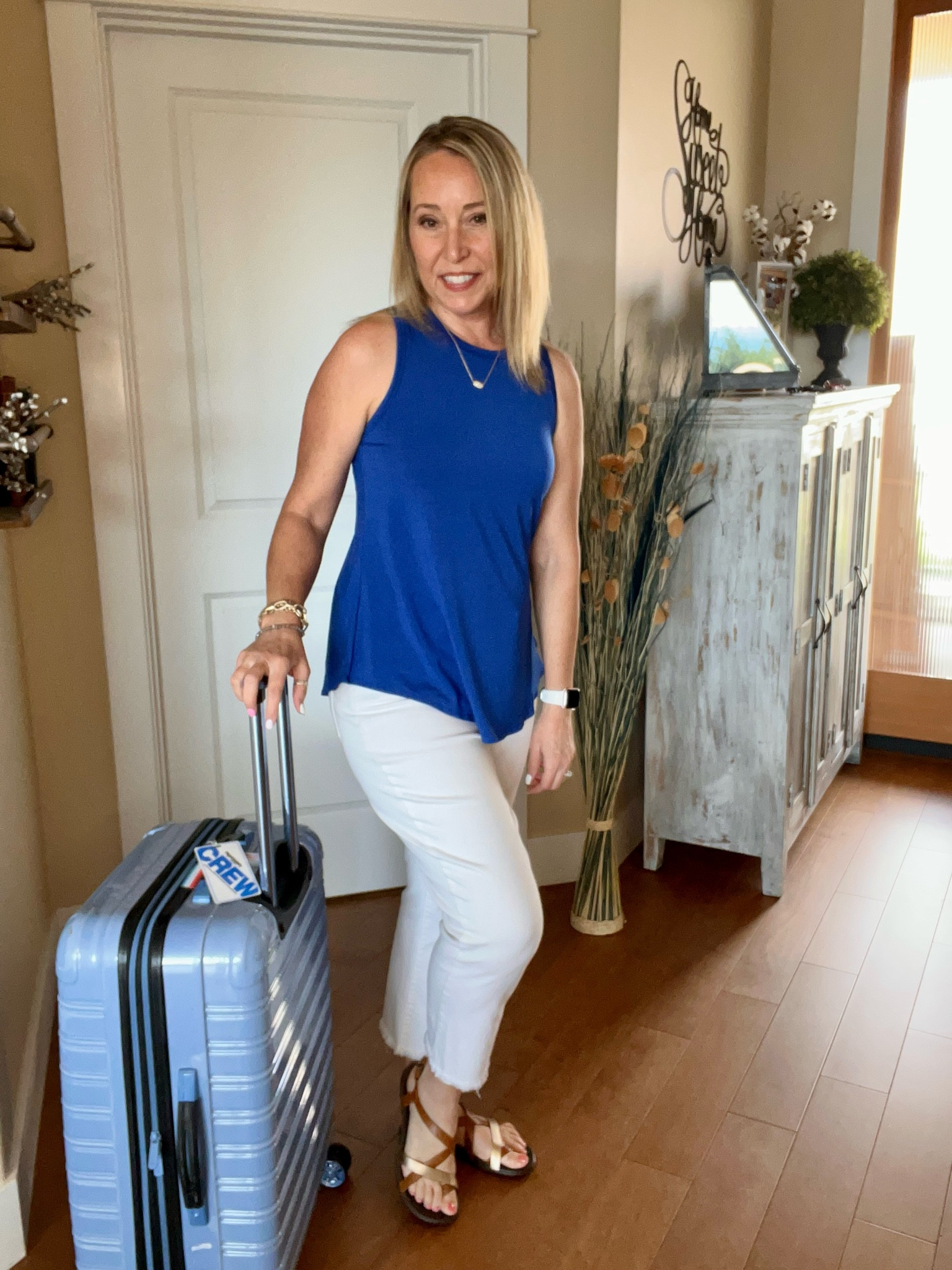 15% off code jennifer15
Favorite Travel outfits always include a Shebird top which has a comfortable and supportive built in bra! 
In love with this gorgeous cobalt blue color! 

Tank top
White jeans
Sandals
Luggage suitcase 
Kendra Scott pendant necklace 

#LTKfindsunder100 #LTKtravel #LTKover40