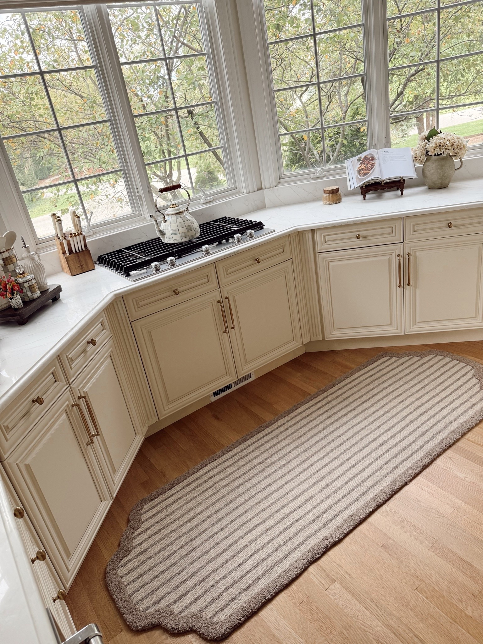 when the rug is the moment ✨ I love me a modern classic look and this beautiful stripe runner is absolutely perfect for our kitchen! 😍 this is the @chrislovesjulia x @loloirugs Emmeline rug in Bone / Ash color. It’s 100% hand tufted wool too! I also fell in love with the pretty curved shape at the corners 🫶🏼 @fromclj

#LTKHome