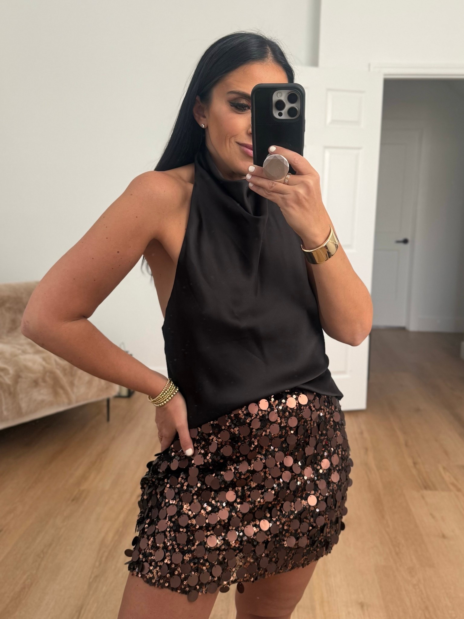 Satin effect halter top wearing size medium. Sequin mini skirt wearing size medium. 