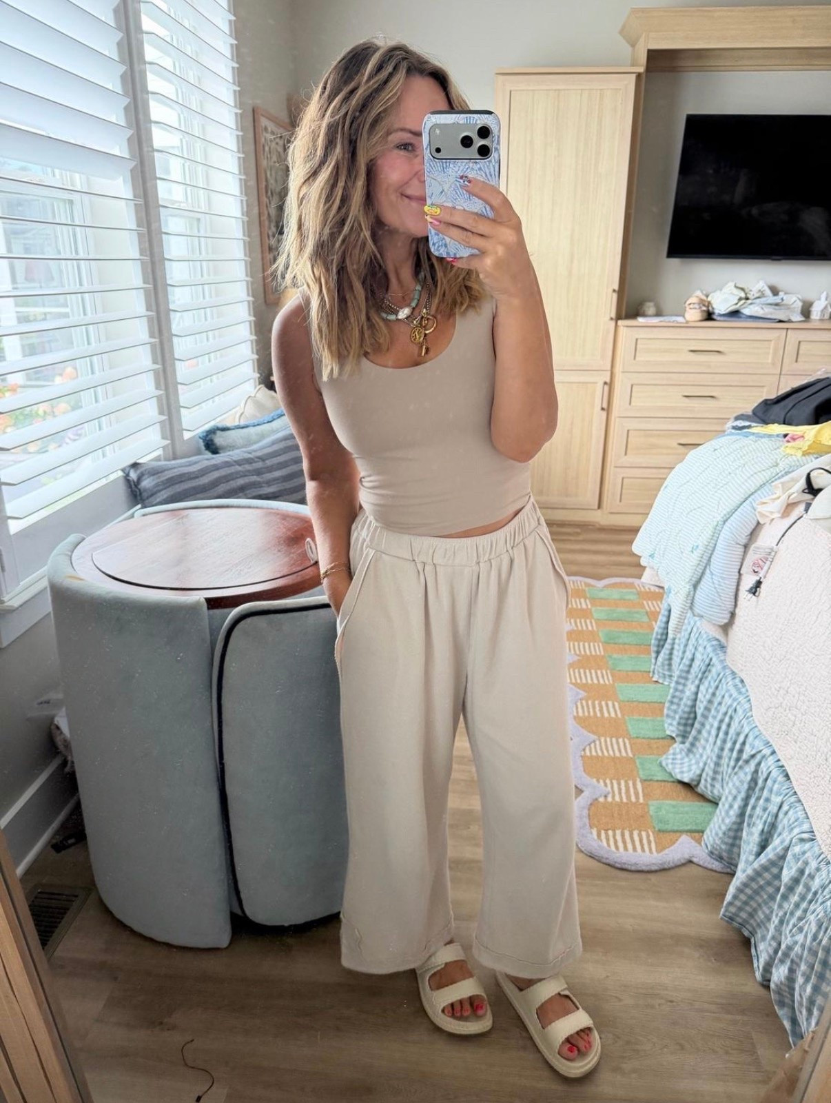 The neutral outfit you’ll wear on repeat 🤍 This matching lounge set is buttery soft, effortlessly chic, and perfect for everything from travel days to coffee runs. Easy to dress up with layered jewelry or keep casual with comfy slides—it’s one of those outfits that always looks put together.

matching lounge set, neutral outfit, travel outfit, airport outfit, wide leg pants, sleeveless tank top, monochrome outfit, comfy casual style, elevated basics, everyday outfit, athleisure, cozy chic, women’s loungewear, platform sandals.