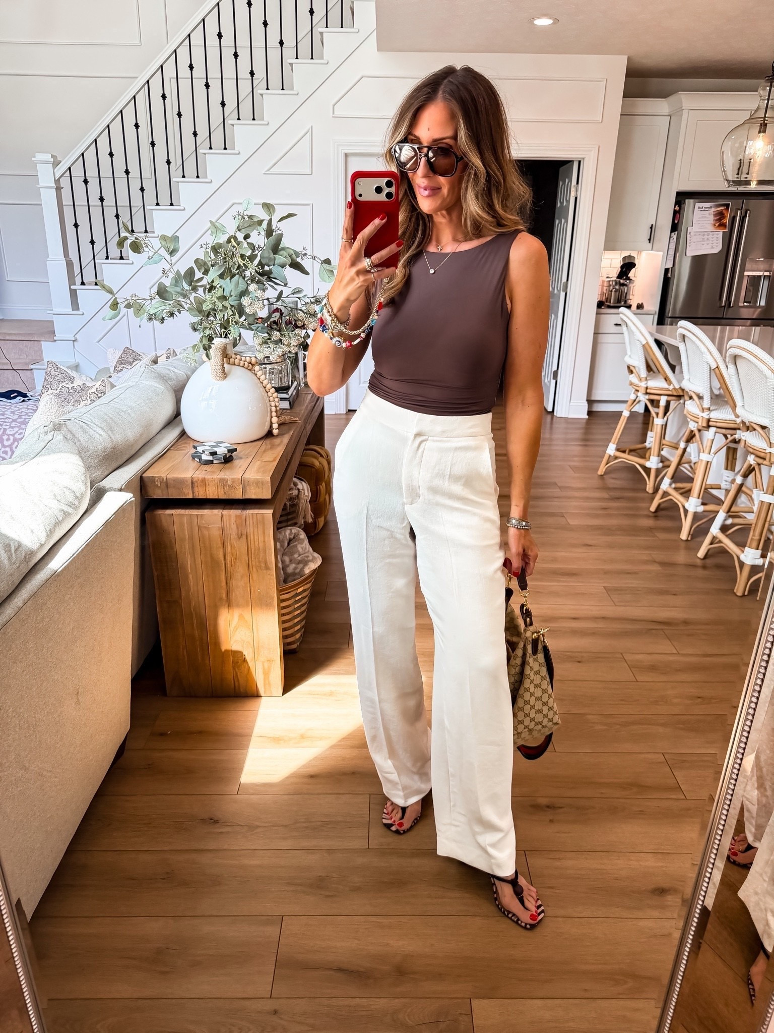 This is exactly how I want to dress when it’s still hot but I’m ready for fall colors. The chocolate brown top with the flowy white trousers feels seasonal without wearing a single heavy layer.

chocolate brown top, white trousers, summer to fall outfit, neutral outfit, wide leg pants, transitional style, elevated casual outfit, everyday fashion, fall color palette, TheMomInStyle

#LTKOver40 #LTKootd #LTKSeasonal