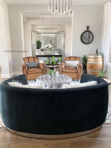 Our black velvet curved loveseat is on major sale. This is the backside of it. So chic and modern.
Leather chairs, topped it ottoman, oversized wall mirror, crystal chandelier, living room furniture, barrel room, wine bar room, sitting room, family room furniture, a Modern Farmhouse Glam. 

#LTKhome