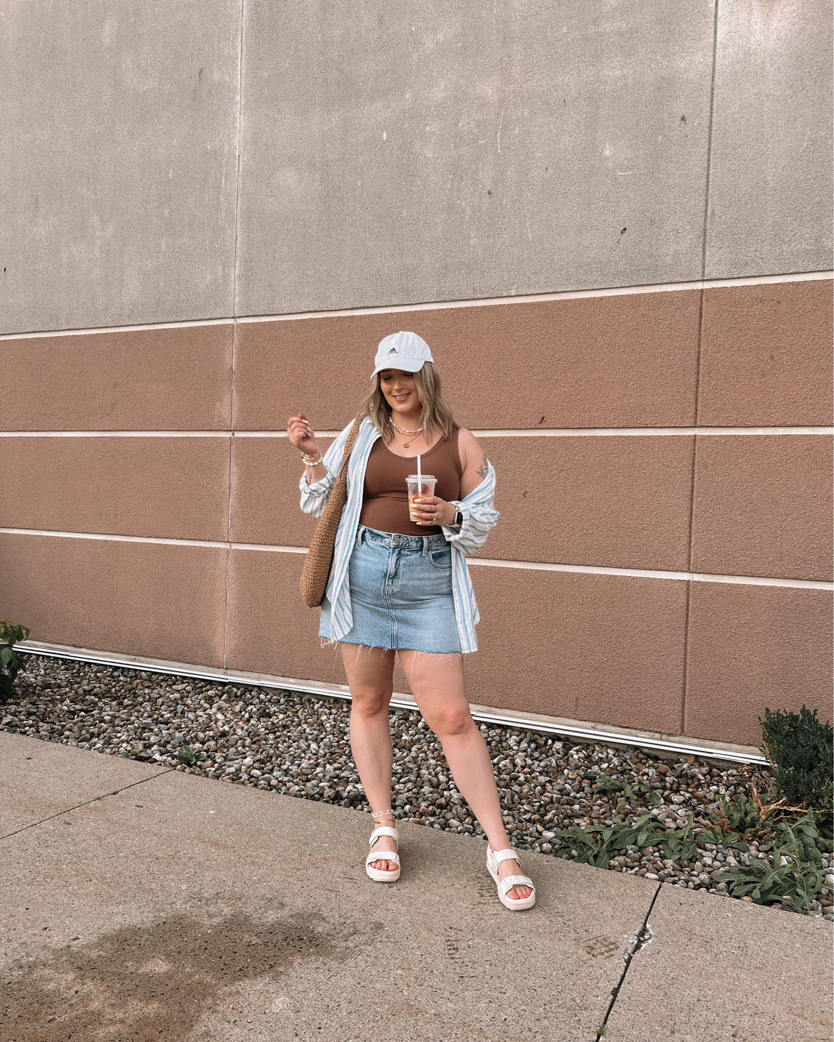 Casual midsize summer outfit - denim mini skirt (size 14), basic tank top (M), striped linen button up shirt (L), dad sandals (run a little big, went down half a size), Amazon straw tote bag, adidas baseball cap 


#LTKmidsize #LTKcanada #LTKsummer