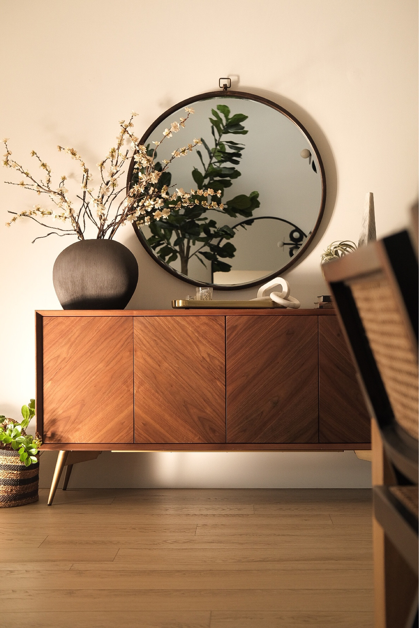 Entryway decor 
Round mirror 
Console table 
Basket 
Black vase 
#meandmrjones 

#LTKunder50 #LTKhome #LTKunder100