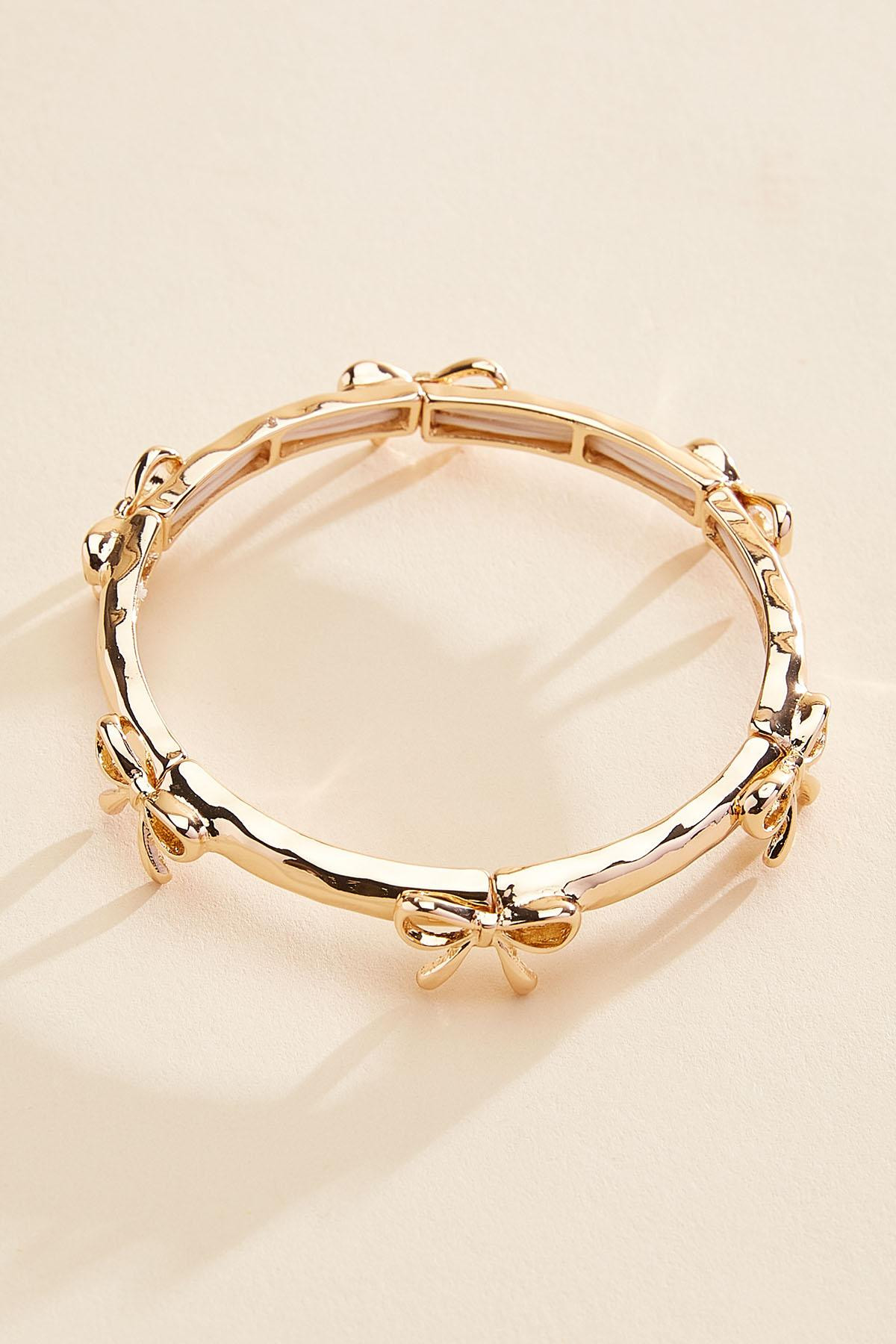 gold bow stretch bracelet | Versona