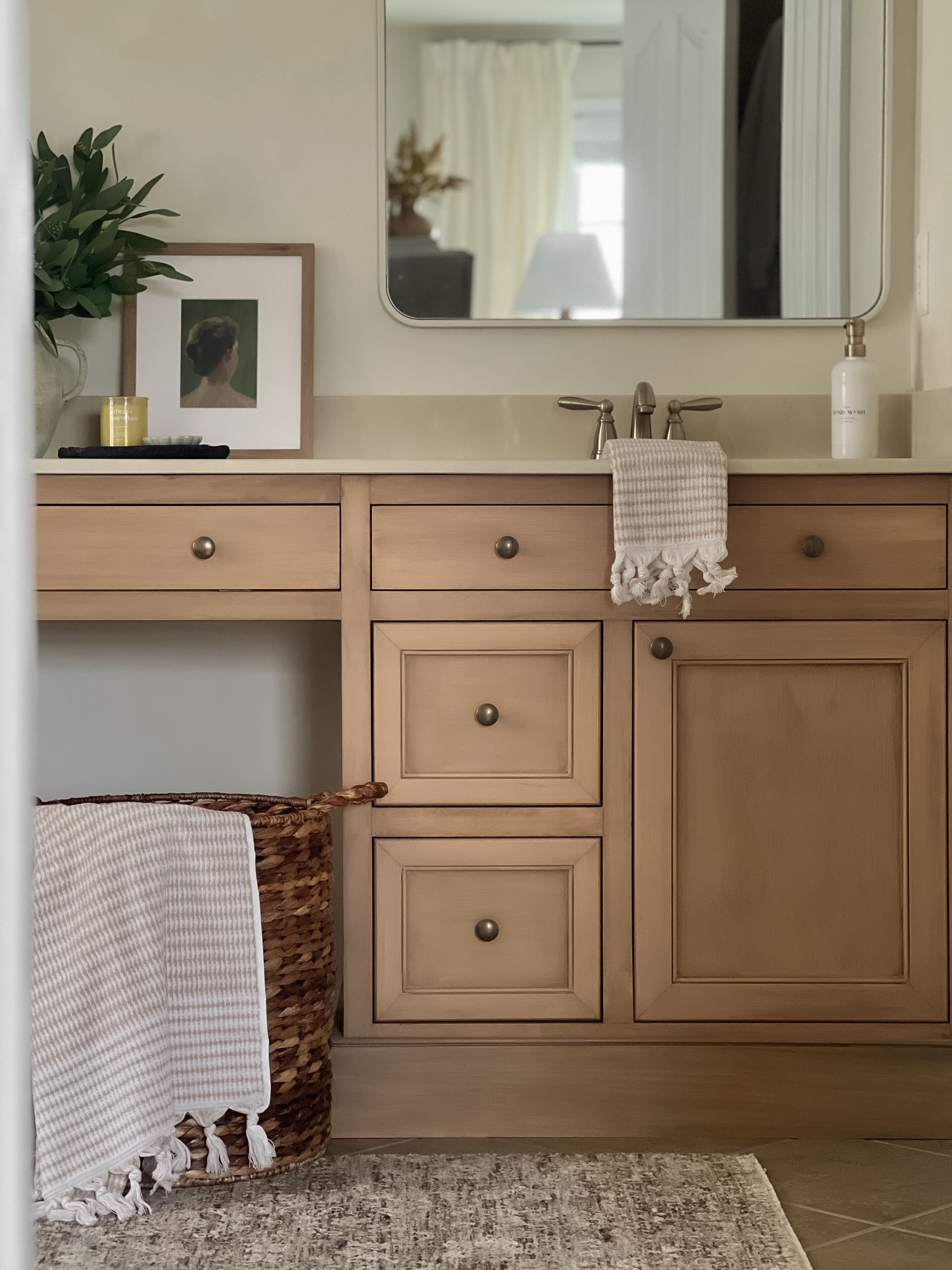 Best way to get a uniform wood look without having to custom mix stains is to use Retique It!

I used the Light Wood Liquid Wood Paint to refinish our master bathroom vanity and then applied a 3:1 ratio stain of Minwax Semi Transparent Stain in Rustic Beige and Retique It! Wood n’Stain in Pecan.

For best results apply in one direction with a damp sponge.

For reference our vanity is made up of 4 different materials: red oak, poplar, white wood, and MDF!

#LTKHome #LTKStyleTip