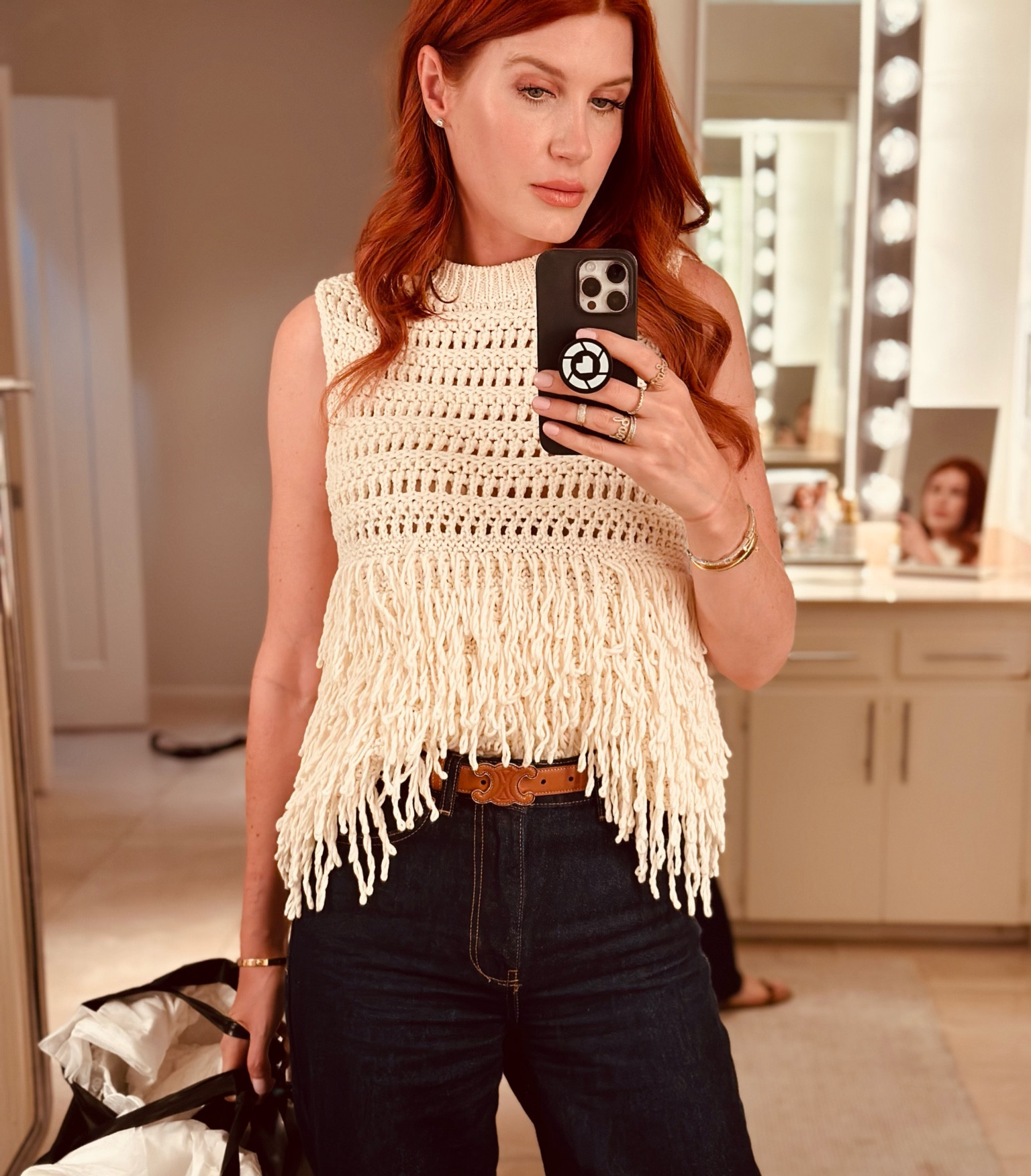 This little fringe sweater makes for a fun look that can go many places. I like it tucked in to my pants to give it a little more shape. I wore it with wide leg jeans and flats for a cool casual vibe. 

#LTKCon #LTKWorkwear #LTKTravel