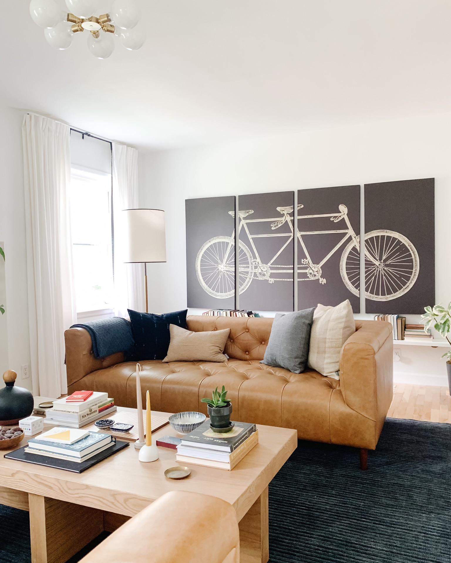 Living room, leather couch, coffee table, wood coffee table, throw pillows, floor lamps, wall sconce, rug, area rug, rug pad, sale, curtain rod, decor, Bluetooth speaker, mirror, brass, art, 

#LTKfamily #LTKhome #LTKstyletip