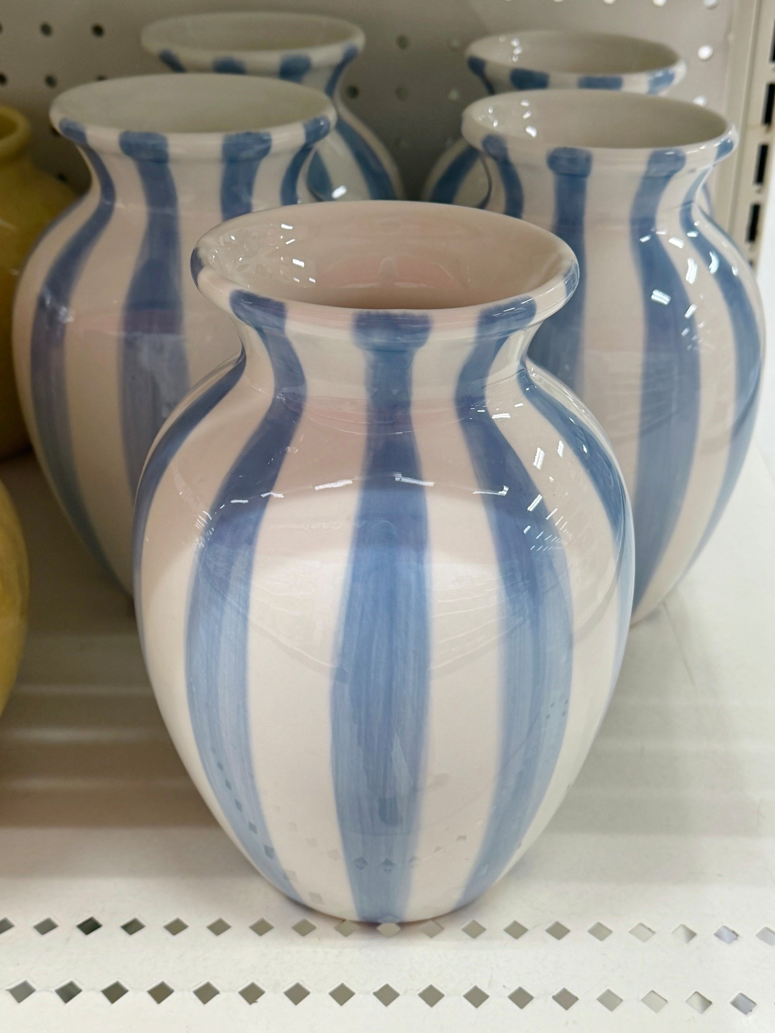 Such a good affordable find! 💙 This $12 tall striped ceramic vase from Target is one of those easy decor pieces that instantly freshens up a space. 🩵 The soft light blue and white stripes feel clean and modern, the size is perfect for consoles or shelves, and it styles beautifully on its own or with faux stems. 🌿 Simple, versatile, and budget-friendly—definitely one to grab. 🤗 Linked here! #TargetFinds #Vase #AffordableDecor 

#LTKSaleAlert #LTKHome #LTKFindsUnder50