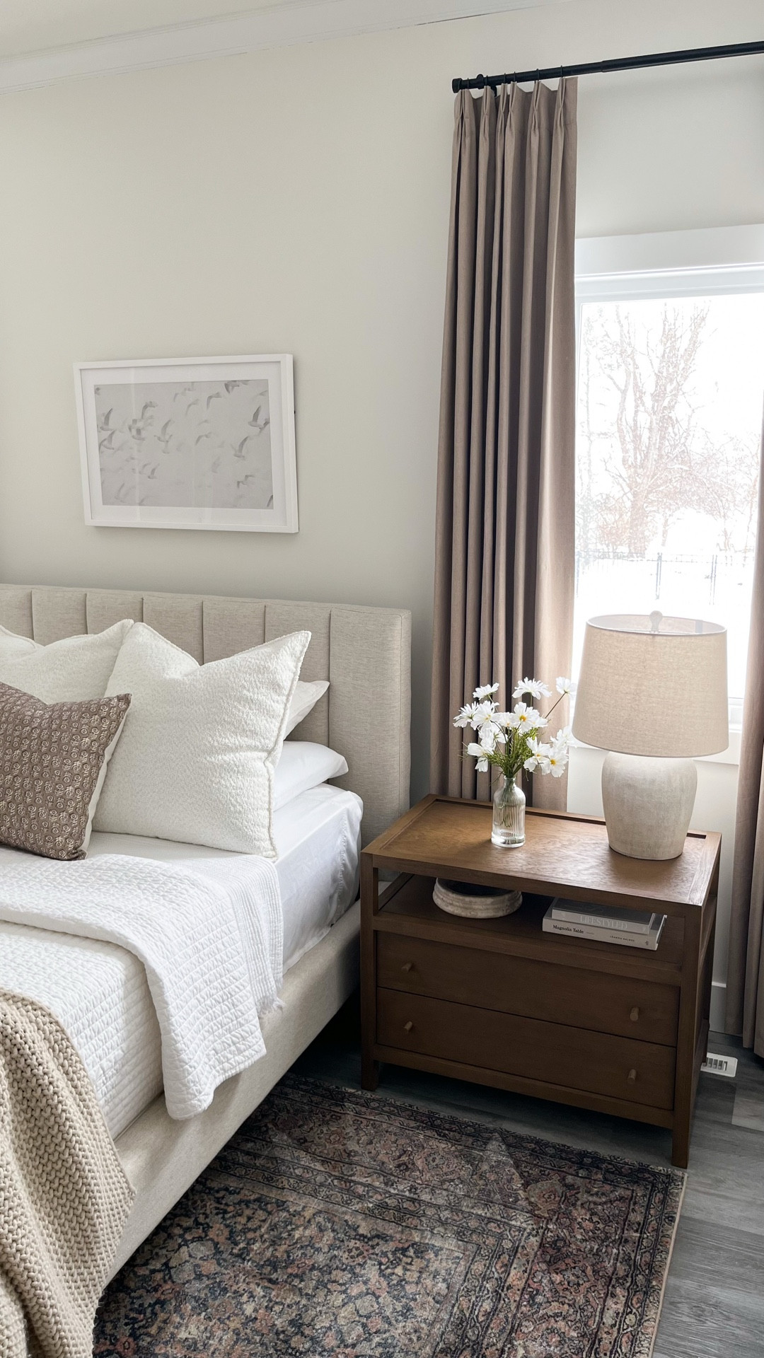 Master bedroom details ✨ 

• Furniture: Crate & Barrel Keane nightstand & dresser in the Driftwood finish 


• Bed: West Elm Emmett channeled headboard and platform bed with metal legs (custom specifics: queen, sand twill fabric & color, vertical tufted headboard style, standard 46” headboard height, dark pewter round leg style & finish)


• Rug: Amber Lewis x Loloi Morgan denim and multi rug 


• Wall art: Cove Prints - “Together” (framed print, 30x20”, white frame finish, with mat)


• Curtains: Amazon black out textured flax linen pinch pleat drapes, in Greybeige, 96” long, hook and black rings included 


• Decor: most home decor is from Target, textured ivory lamps are from Kirklands, faux lilac floral stems are from Pottery Barn


Bedding: 
• Sheets: Cariloha Classic Bamboo Bed Sheet Queen Set in White 
• Waffle knit bed blanket is old from Home Goods, linking similar styles!
• Quilt: white quilt is from Target
• Casaluna chunky knit bed blanket in Natural


Throw pillows: 
• 22” cream chenille boucle pillows are the brand From The Studio Home Textiles, & I found them at Home Goods! Can’t link these exact pillows but I’ll link other similar boucle pillows!
• 18” Foindtower neutral floral print throw pillows in the iced coffee color


#LTKselfcare #LTKdayinmylife #LTKHome
