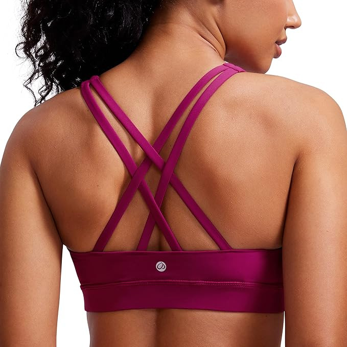 CRZ YOGA Women's Strappy Sports Bras Fitness Workout Padded Yoga Top Criss Cross Back Cami | Amazon (US)
