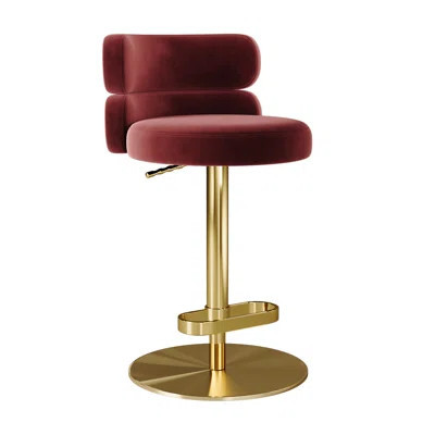 Burgundy velvet swivel bar stool with low back and gold pedestal base