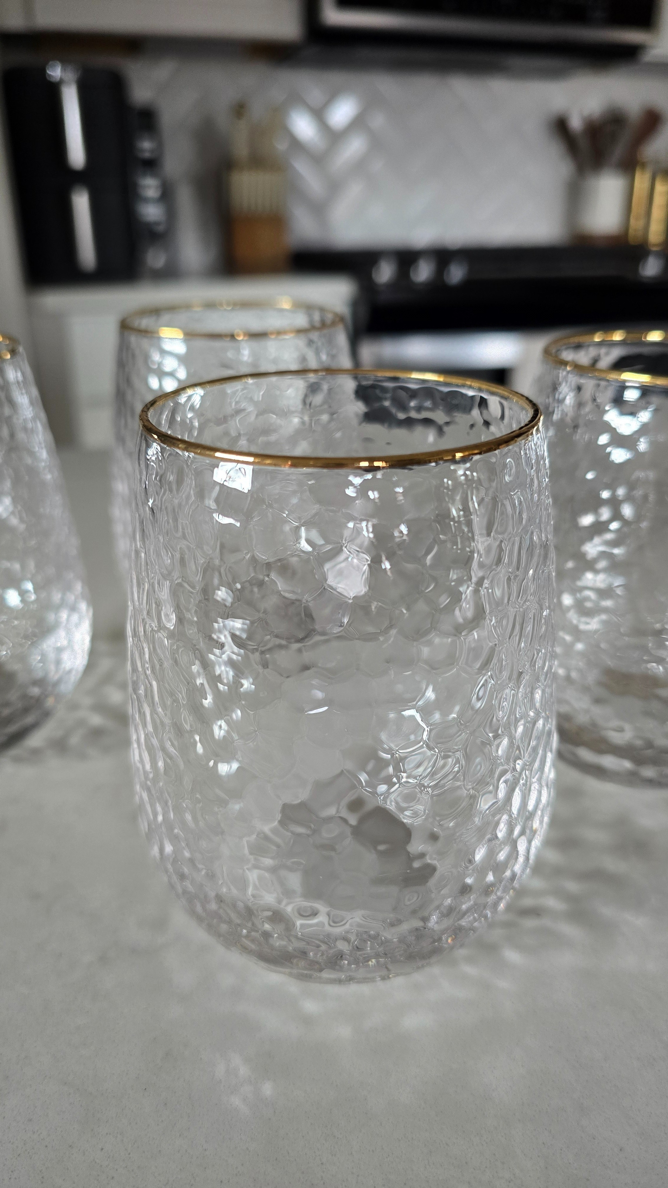How stunning are these gold-rimmed hammered glass wine goblets from Target? ✨ They look so luxe but are only about $8 each — even the matching drinking glasses. Perfect for everything from cozy nights in to holiday hosting.#TargetStyle #HomeEntertaining

#LTKHoliday #LTKSeasonal #LTKHome