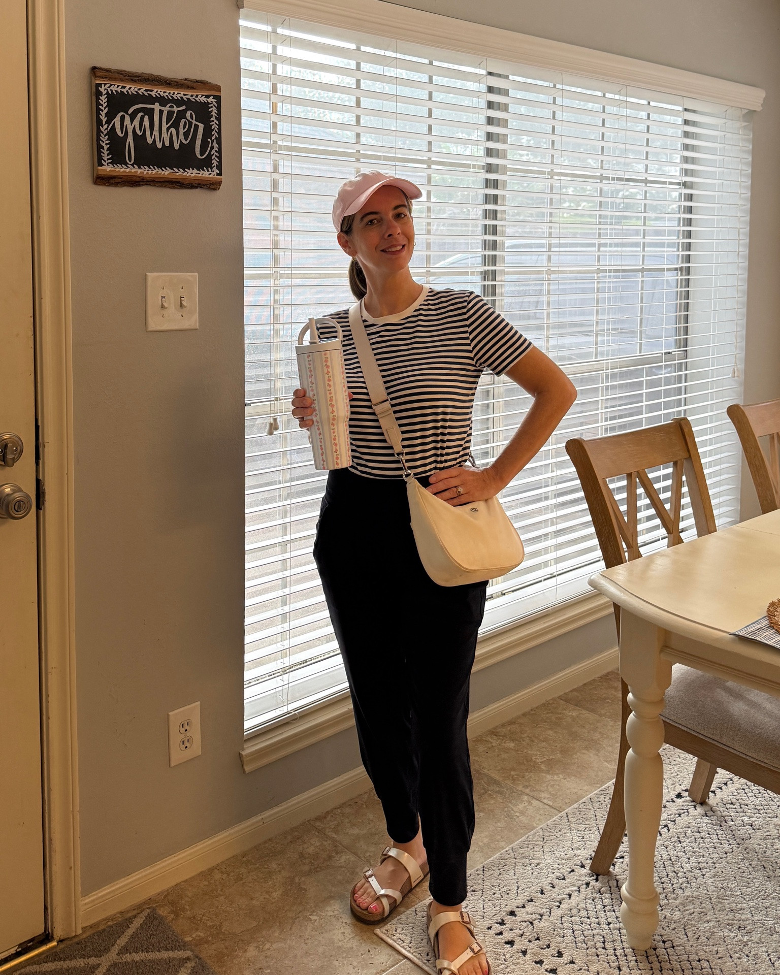 Running errands in a casual navy and white striped tee with navy joggers. Styled with a pink cap, crossbody bag, and Birkenstock sandals for comfort.

#LTKootd #LTKOver40 #LTKPetite