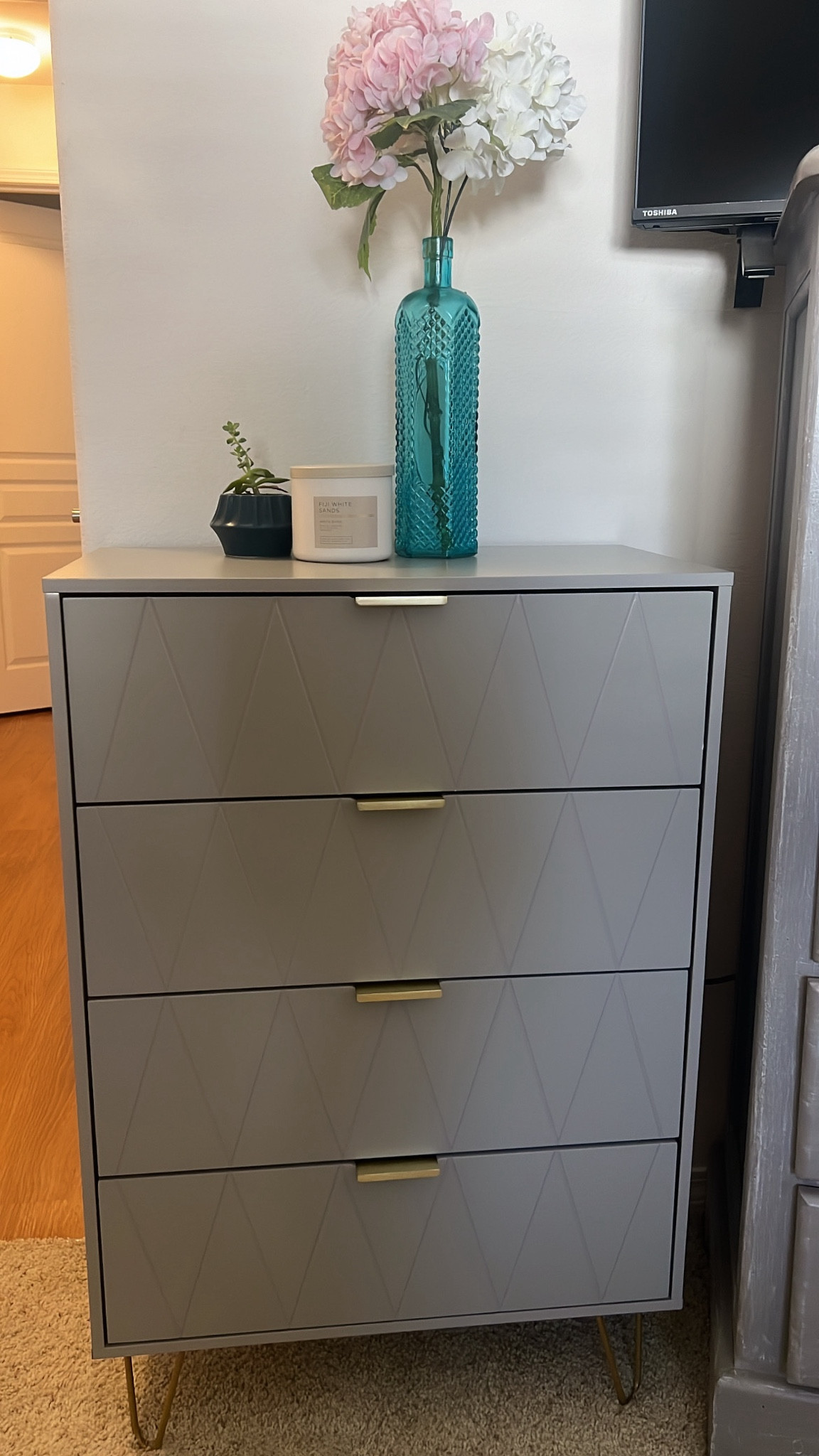 Tall grey dresser with gold accents

Modern furnituree 

#LTKFallSale #LTKHome #LTKU