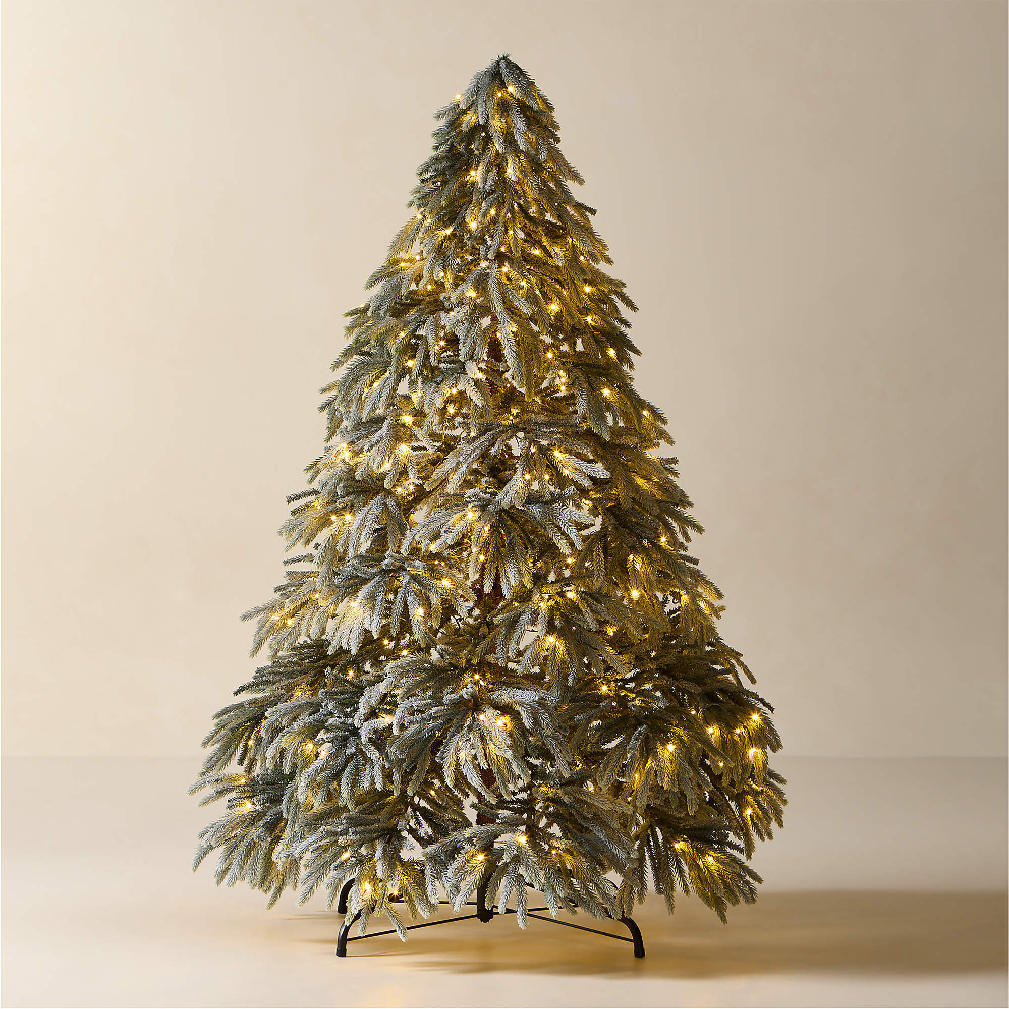 Faux Downswept Flocked Pine Pre-Lit LED Christmas Tree with Warm White Lights 7.5' | CB2 | CB2