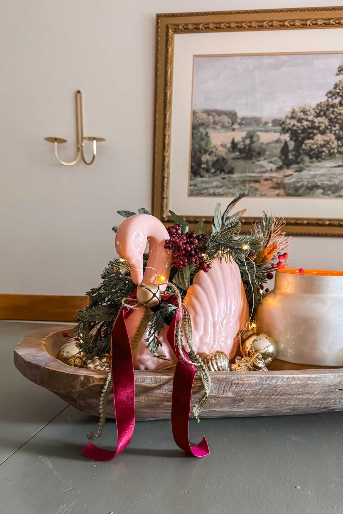 Brought back my old dough bowl (tell me you remember the dough bowl phase too 😅) and made a little Christmas moment with a thrifted pink swan, ribbons, a bell, my never-ending Anthro candle, an old ornament strand, and twinkle lights. Cute? Weird? Kinda both??

#LTKSeasonal #LTKHoliday #LTKHome