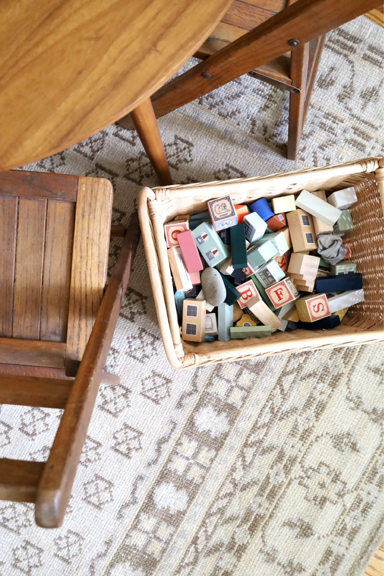 My go-to is pairing modern pieces (this kids play table from West Elm) with vintage market finds (these youth stadium chairs). Also, baskets solve all storage solutions for quick toy clean-up.

#LTKhome #LTKbaby