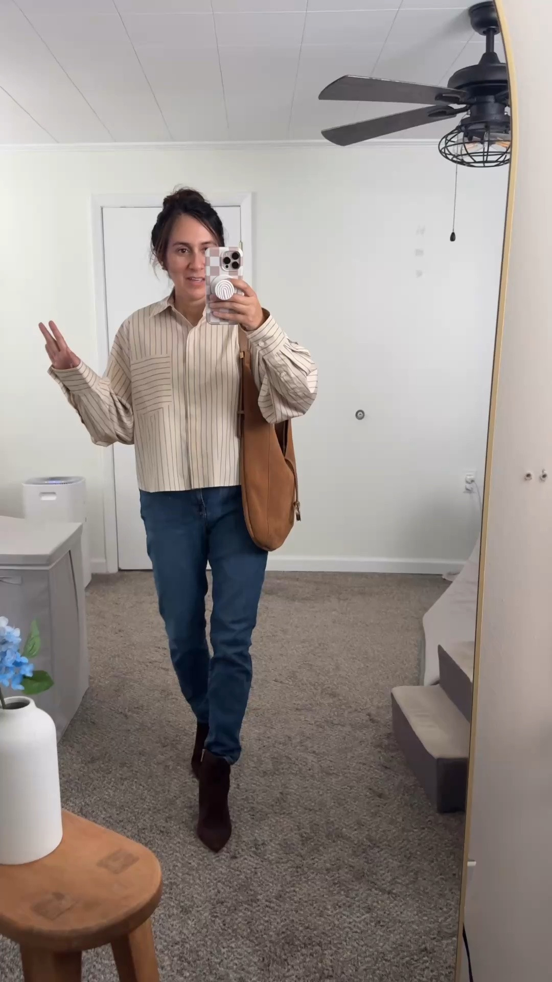Looking for a striped button-down shirt that feels polished but still relaxed? This oversized neutral blouse is such an easy fall wardrobe staple. 

The slightly cropped fit, roomy sleeves, and mixed stripe details give this classic shirt a modern update. I styled it with skinny jeans but it would go nice with some straight-leg jeans. I am wearing pointed-toe ankle boots, and a brown suede shoulder bag for an effortless casual fall outfit.

#LTKootd #LTKSaleAlert #LTKOver40