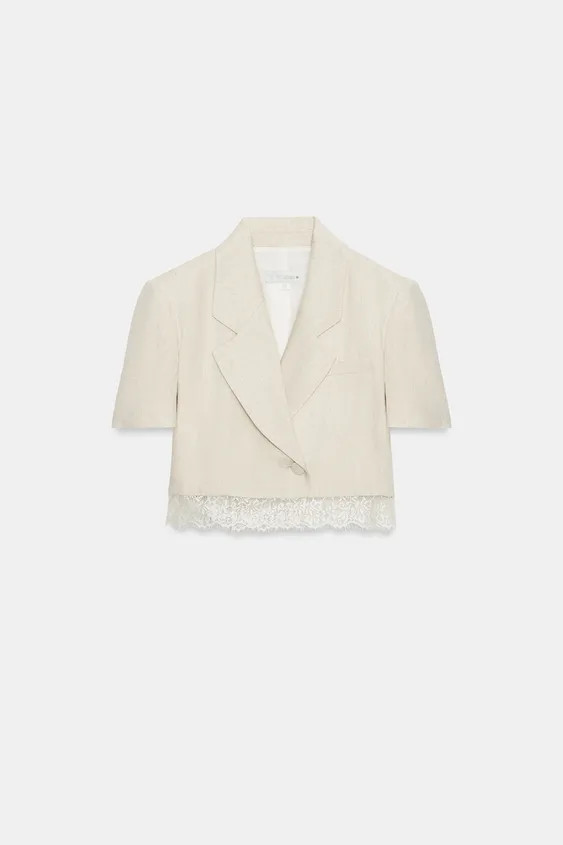 Short sleeve blazer with a lapel collar and shoulder pads. Featuring a lace hem and double-breast... | Zara UK