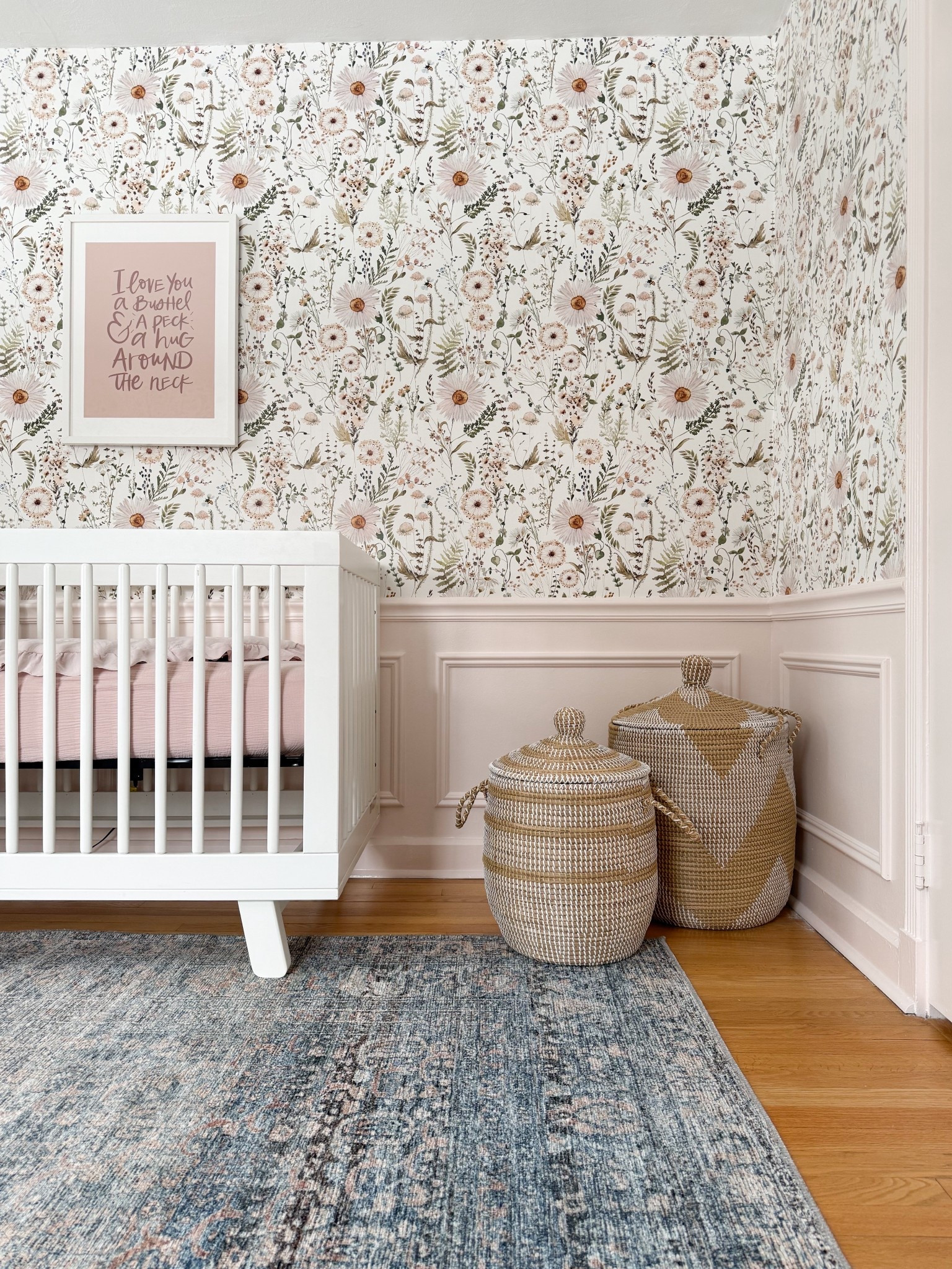 This mix of soft florals, woven textures, and classic nursery pieces feels like such an easy way to create a space that’s both functional and visually interesting. I love how the wallpaper adds detail, the woven baskets bring in warmth and storage, and the crib keeps everything feeling clean and timeless. It’s a combination that feels layered without being overwhelming.

floral wallpaper nursery, woven storage baskets, nursery organization ideas, neutral nursery decor, crib styling ideas, cozy nursery textures, vintage style rug nursery, nursery corner decor, soft feminine nursery, kids room storage solutions, layered nursery design girlonthehudson

#LTKHome #LTKBaby #LTKKids