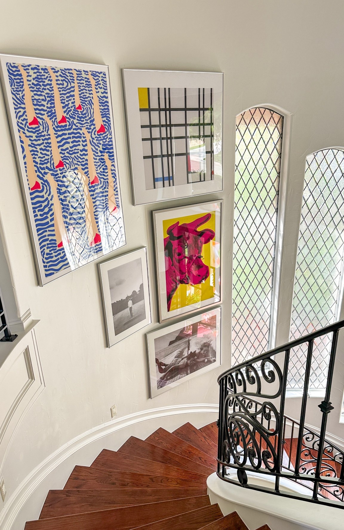 Our newest art! Check out this curved stairway foyer gallery wall! 

#LTKHome