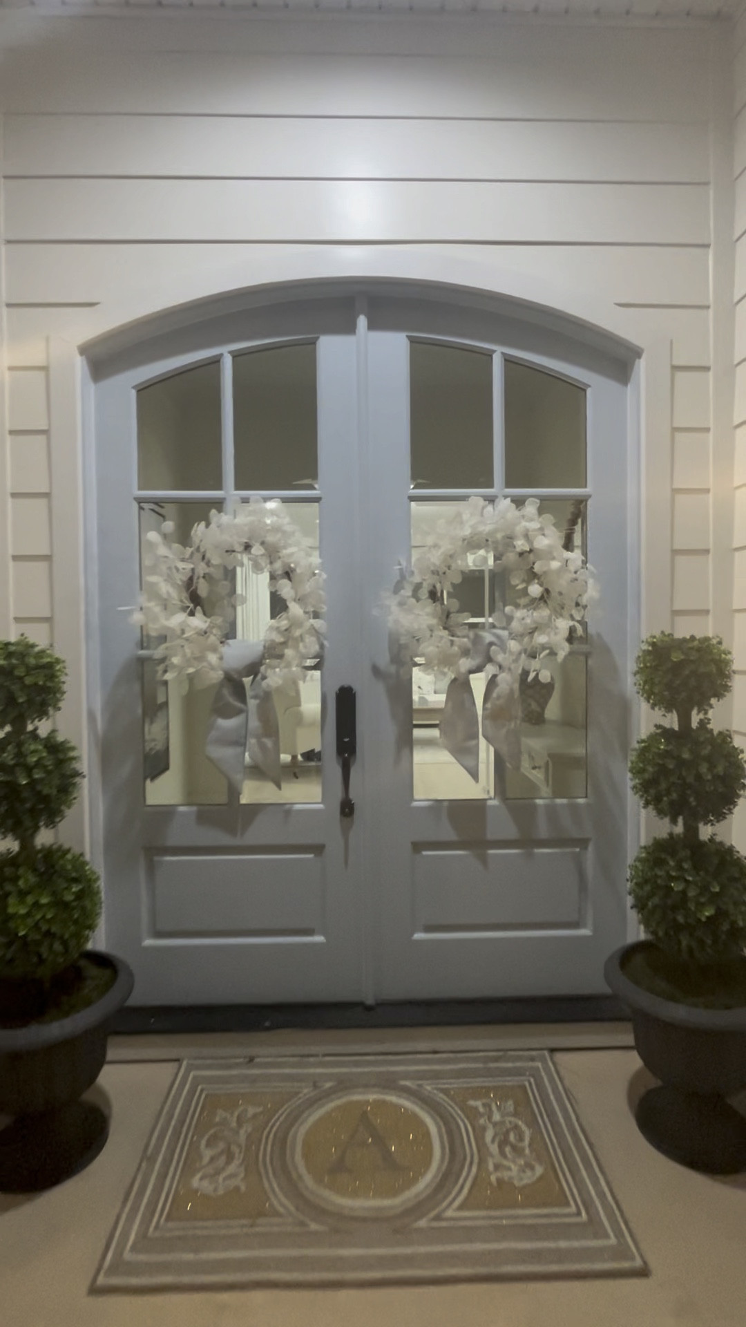A little night time view of my front porch here on the homestead. Put these ivory wreaths back on until spring. They’re just too pretty to put away.

#LTKFindsUnder100 #LTKHome #LTKWatchNow