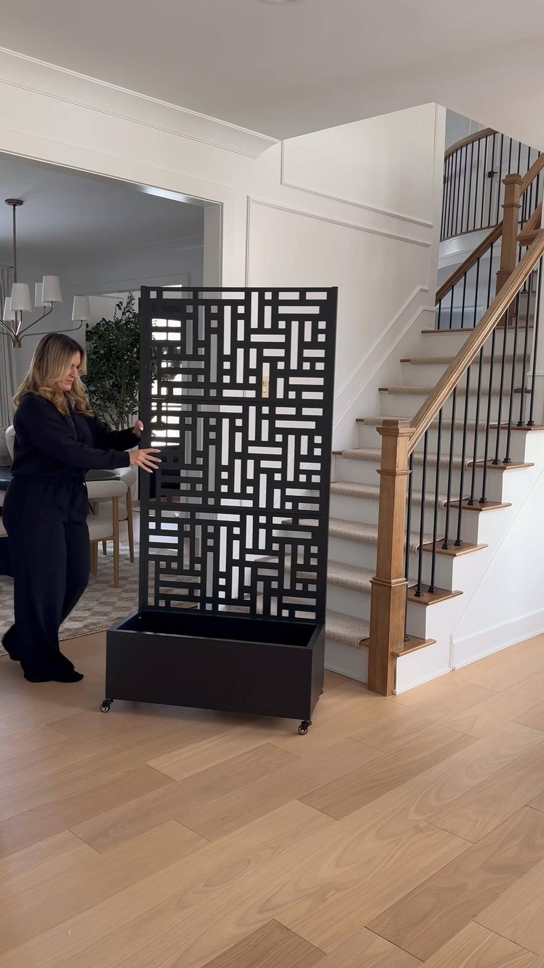 Rolling privacy screens and planters.

#LTKHome