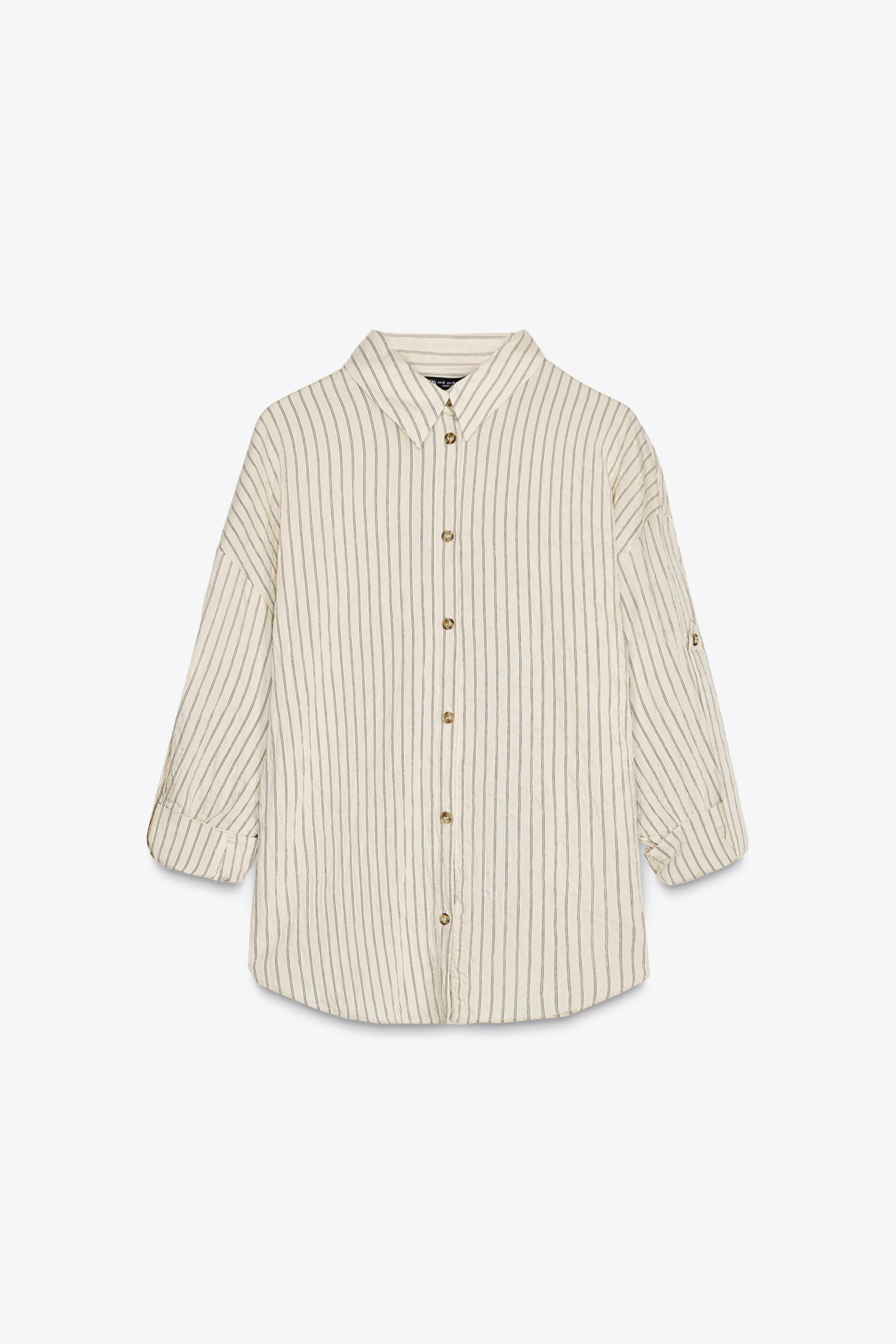 Loose-fitting shirt with lapel collar and long sleeves with buttoned tab. Front button closure. | Zara US