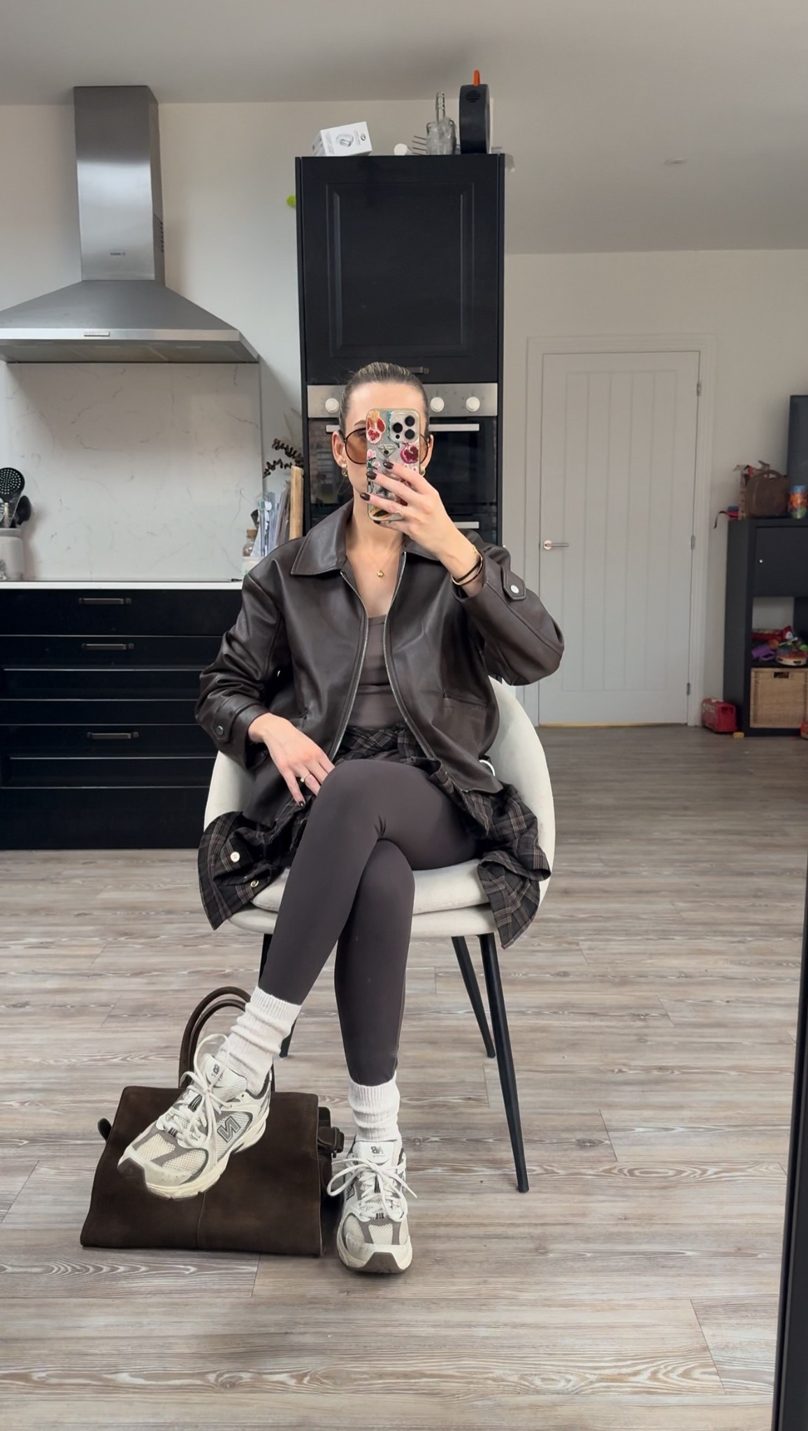 An all brown casual leggings outfit idea styling a faux leather bomber jacket and brown leggings with my new balance 530. Accessorised with a plaid shirt around my waist 

#LTKwinter #LTKuk #LTKstyletip