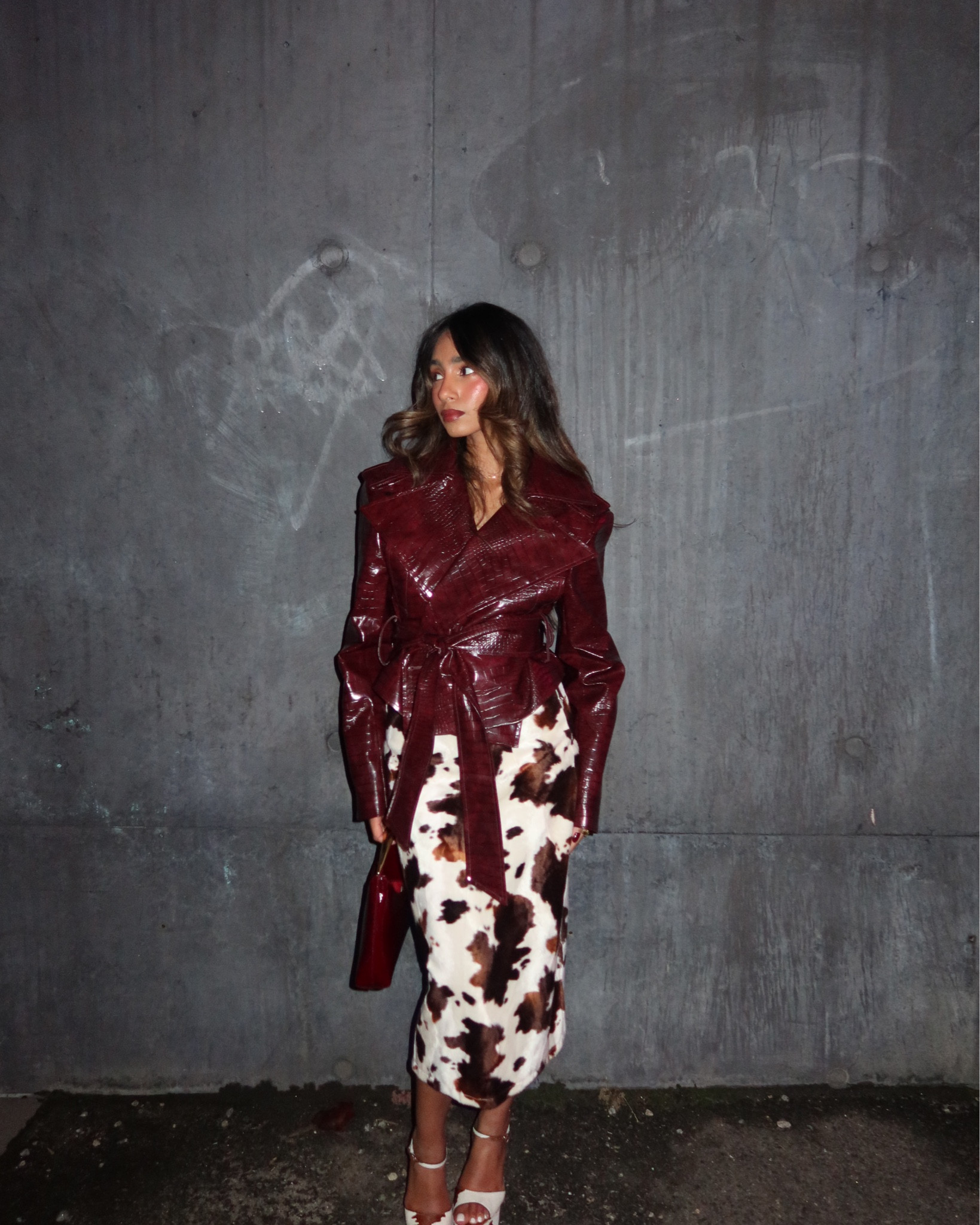 Cow print outfit with red burgundy leather jacket paired with cow print heels and burgundy hand bag 

#LTKFashionMonth #LTKaustralia #LTKxMeshki2026
