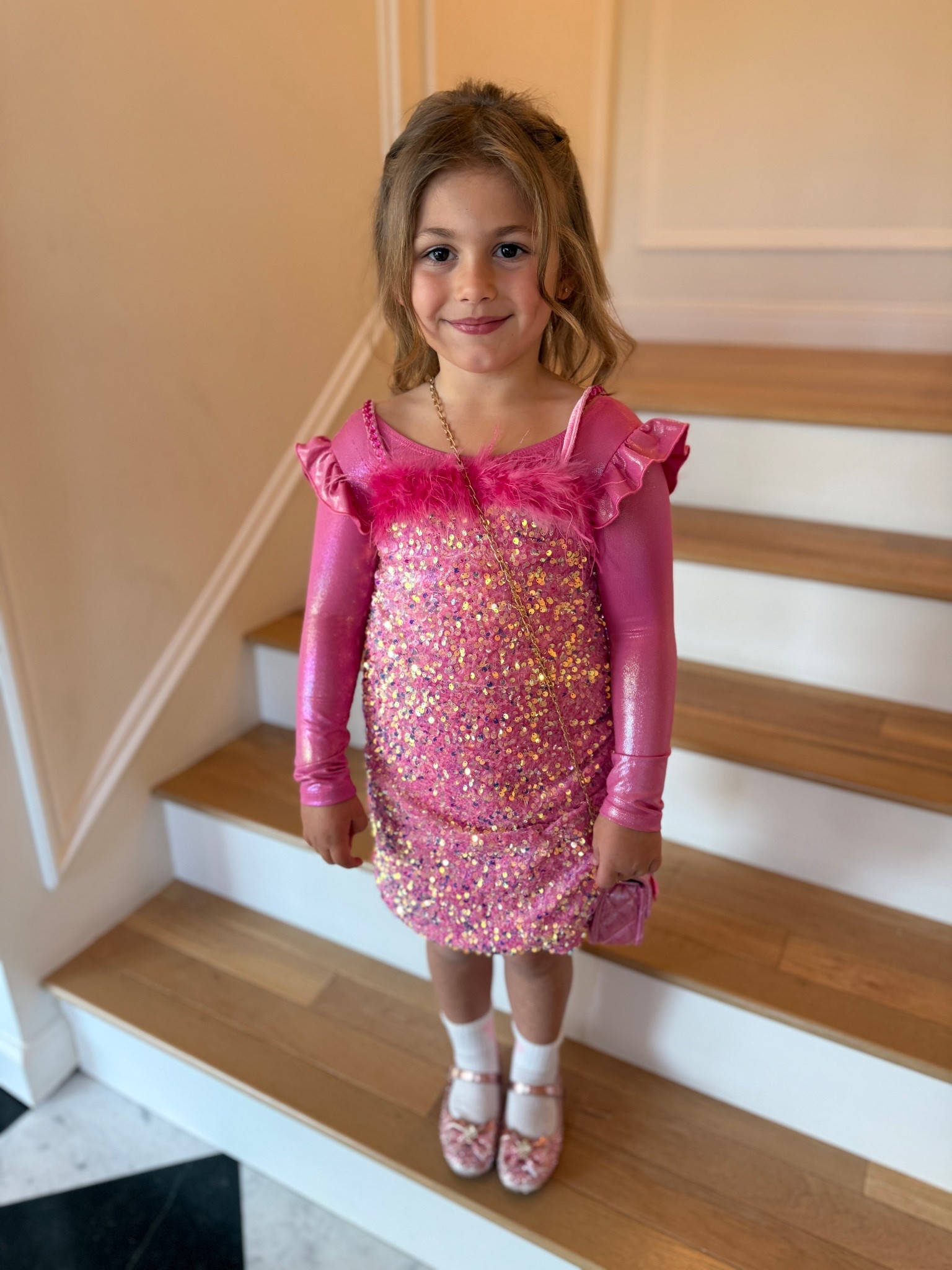 Adorable sparkly pink dress with feathers from Lola and the Boys! We added a gymnastics body suit to make it a little warmer (and less itchy!) 

#LTKKids #LTKmomlife