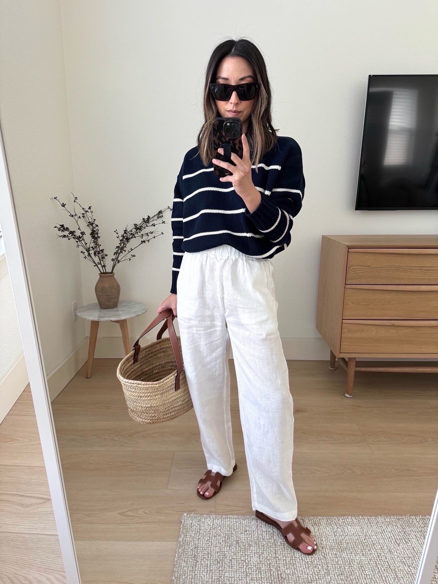 Quince 100% Organic Cotton Striped Crew Sweater - Love the quality! I have the designer one and it's identical in style and quality for a fraction of the price. This one runs TTS.

100% European Linen Pants - Length is petite-friendly. Elastic was, so comfy and casual. Wider in the thighs and then a slight taper at the ankle. 

Quince sweater xs
Quince pants xs -white is sheer. 
Hermes Oran sandals 35
Loewe tote medium
celine sunglasses

Petite outfits, summer outfits, purse, sandals, vacation

#LTKootd #LTKmomlife #LTKPetite