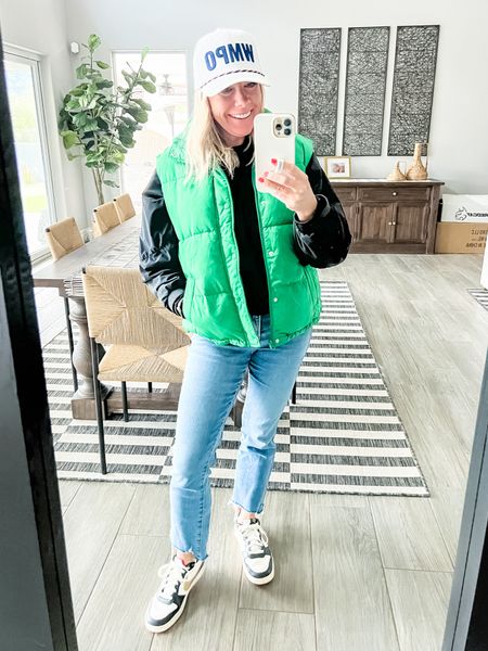 Love this bright green puffy vest with an alo half zip, jeans and Nikes. Jeans run big go down one size. Small vest and pullover  

#LTKover40 #LTKstyletip #LTKSeasonal