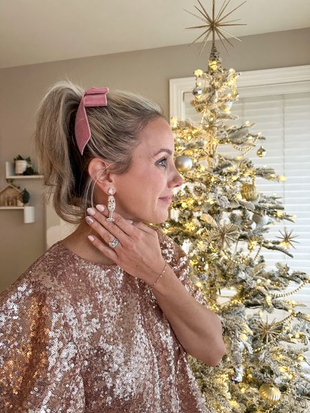 Bow and Sequins
 Christmas party outfit | holiday look | sequin top | bow hair clip | champagne earrings 

#LTKparties #LTKHoliday #LTKSeasonal